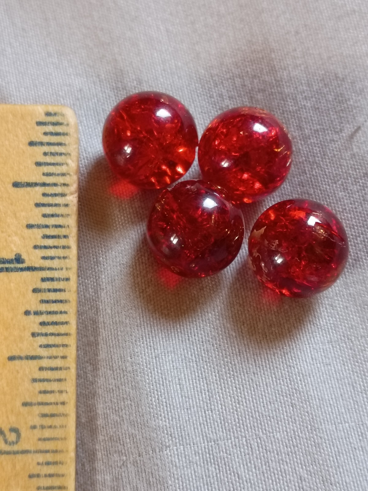 4 Vintage 1/2″ Red Crackle Glass with Cadmium Playing Marbles.