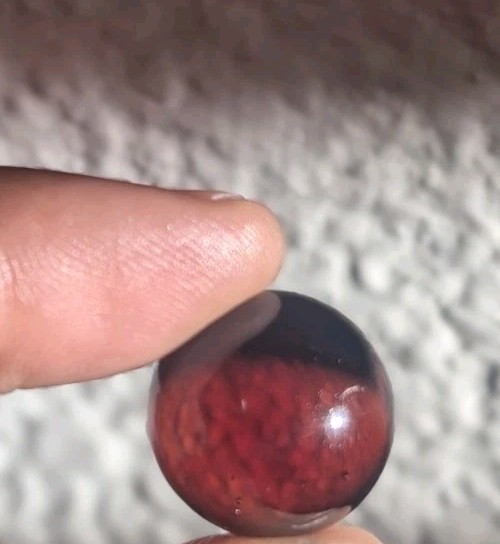 UV Reactive Cadmium Red Clearie Vintage Glass Marble .61 Orange Swirl Glow