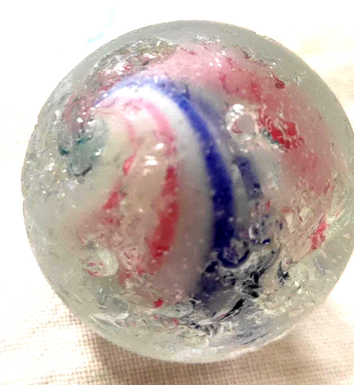 TOY MARBLE 1.1” marble trilevel ,solid core, 4 panel ribbon swirl, requ ground