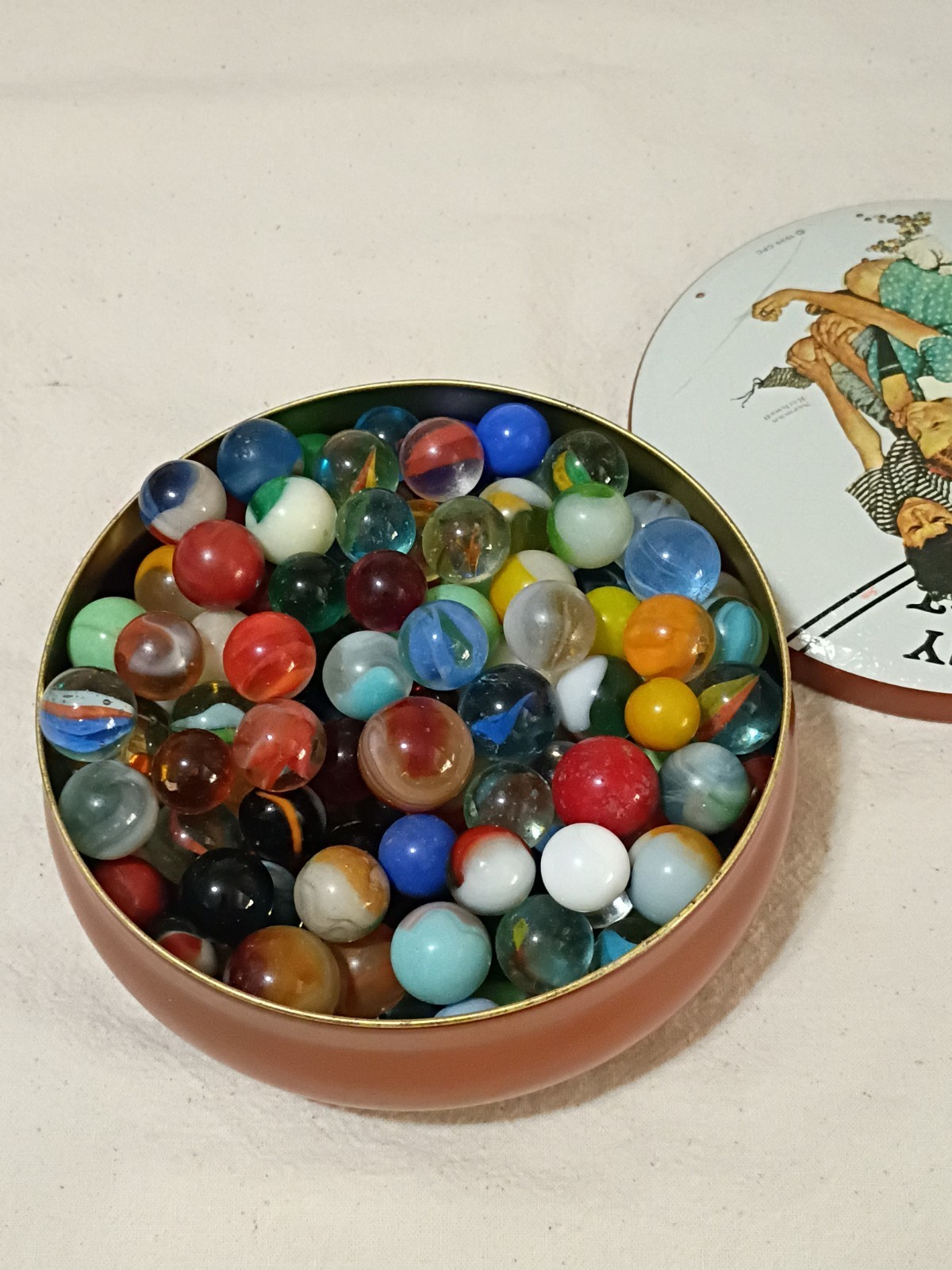 Norman Rockwell “Marbles Champion” Tin Full Of Vintage & Antique Marbles
