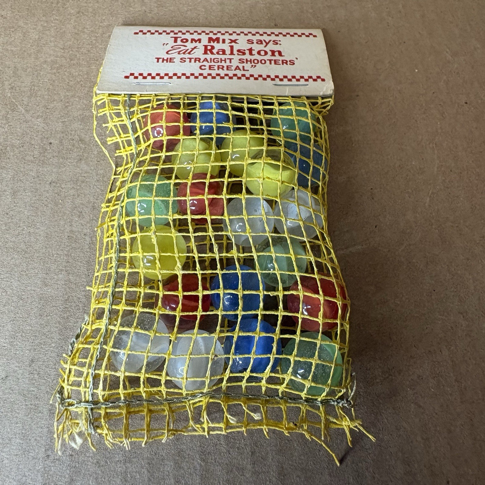 Tom Mix Straight Shooter Marbles 1940’s Damage to Bag Complete with Tag Vintage