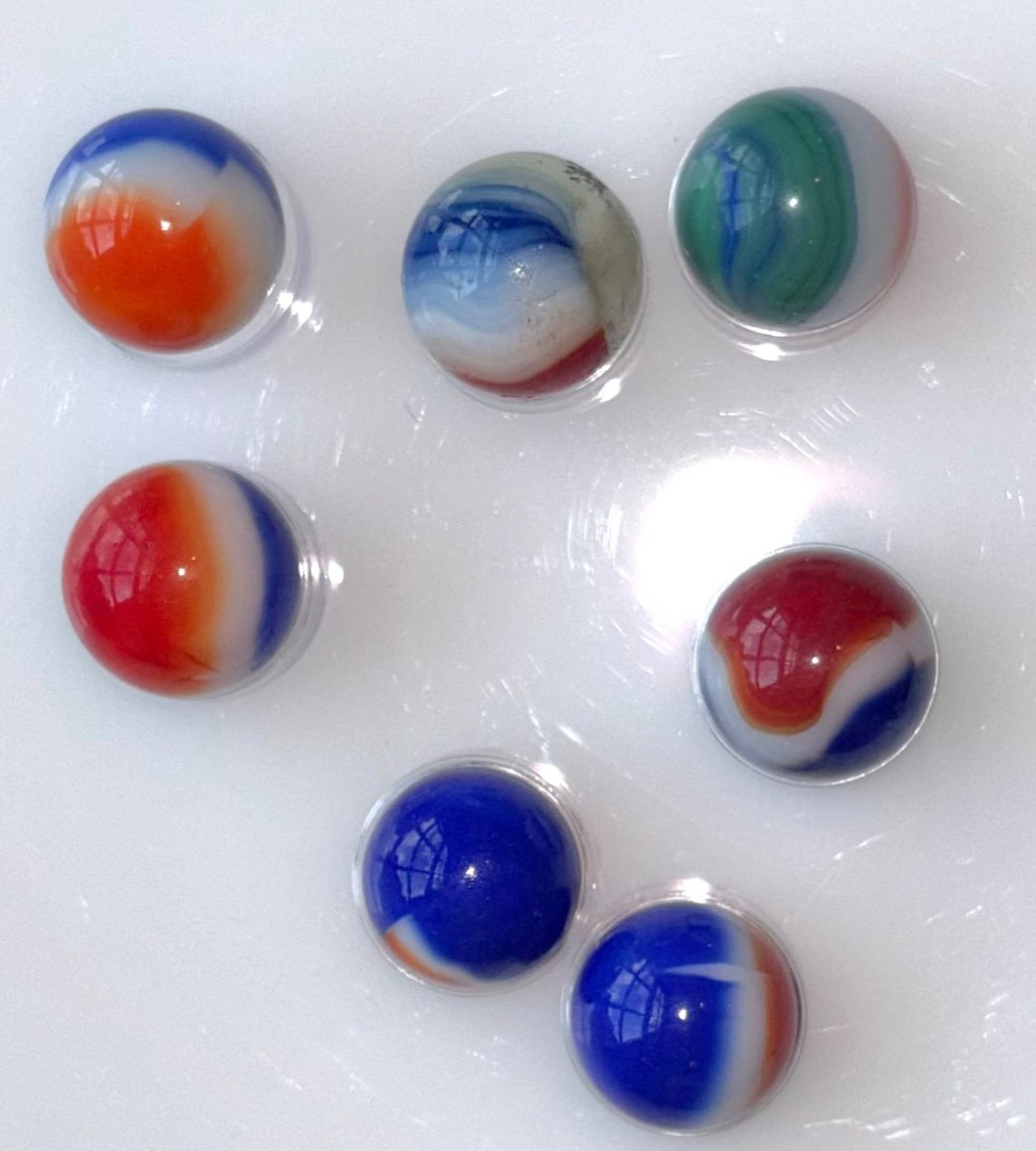 7 VTG Glass Marbles-6 Red White Blue, 1 Red White Green, Approx .57″-.62″ Lot 12