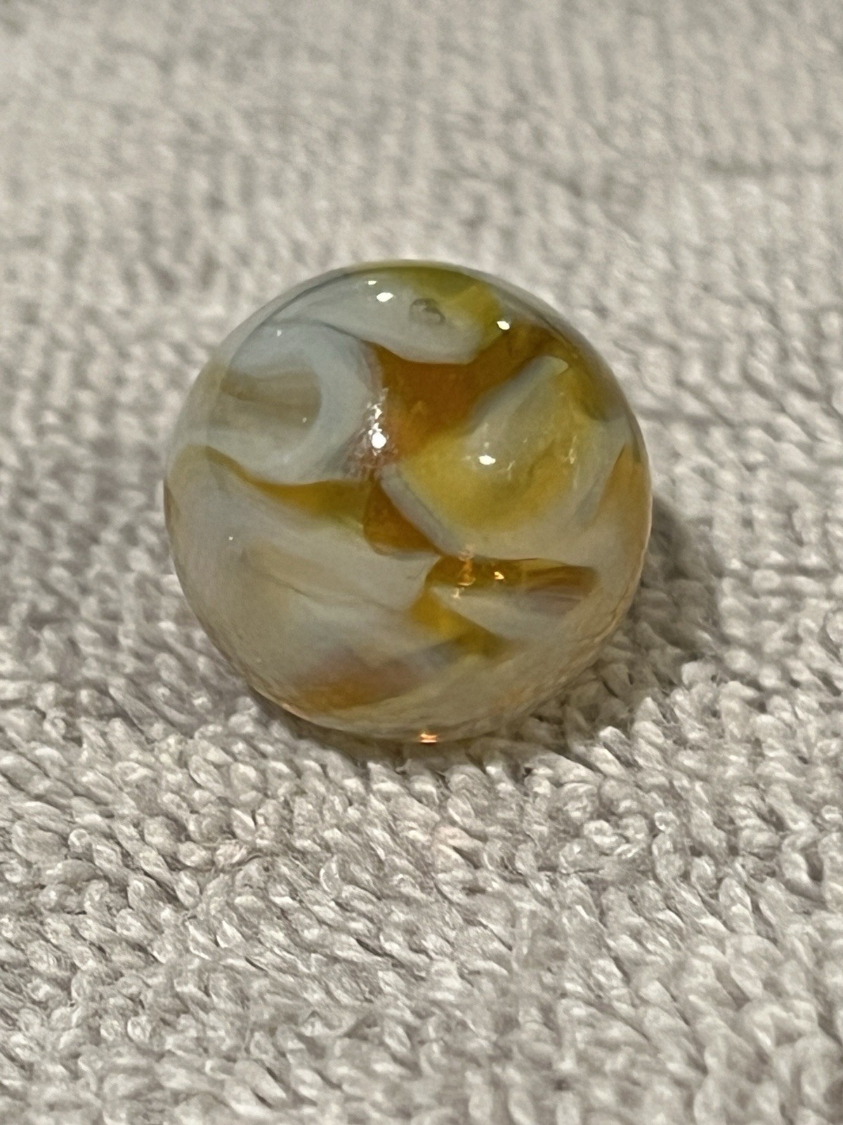 Alley or Champion Yellow Gold Translucent Furnace Swirl .63 Wet Mint