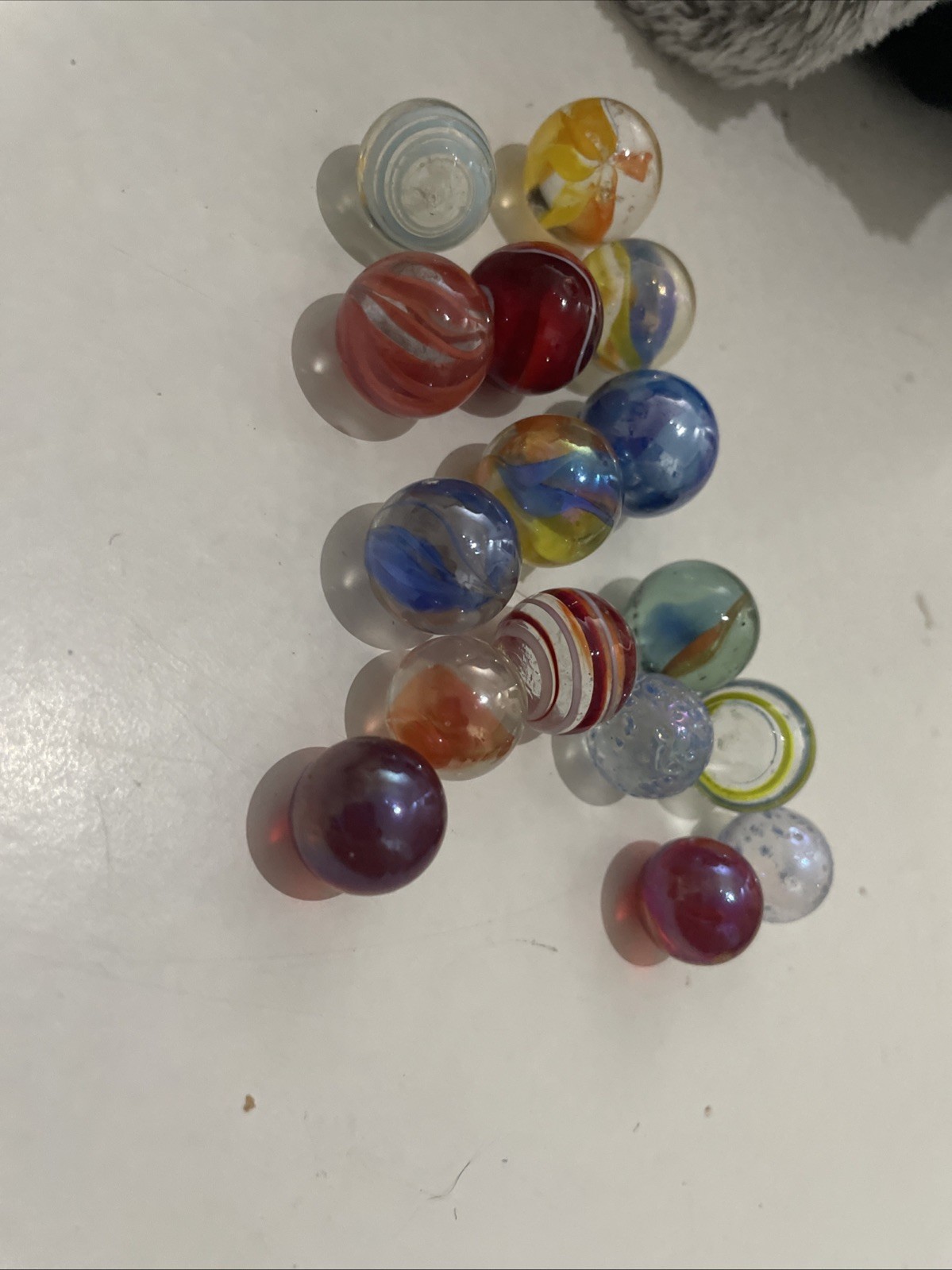 5 Tiny Marbles And 11 Small Marbles