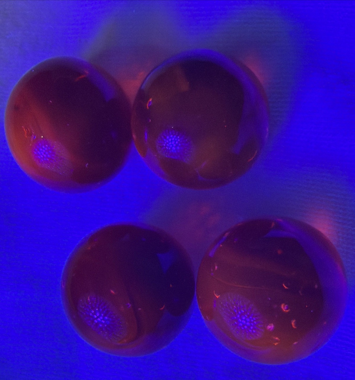 Vintage Lot of 4 Clear Ruby Red Cadmium Slag Glass Marbles UV Reactive As Is