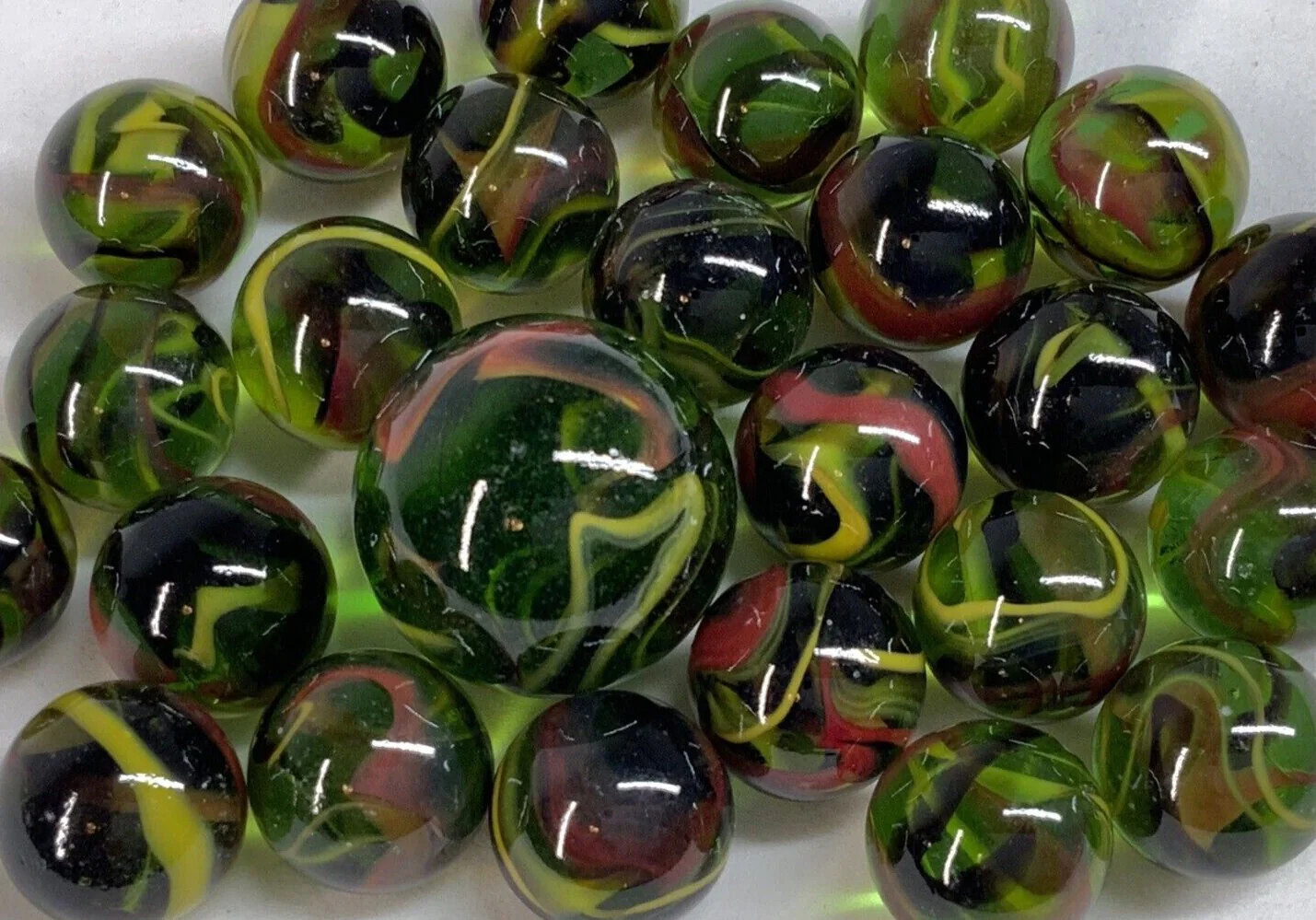 25 Marbles T-REX Green Glass Red/Yellow Swirl game pack vtg style Shooter