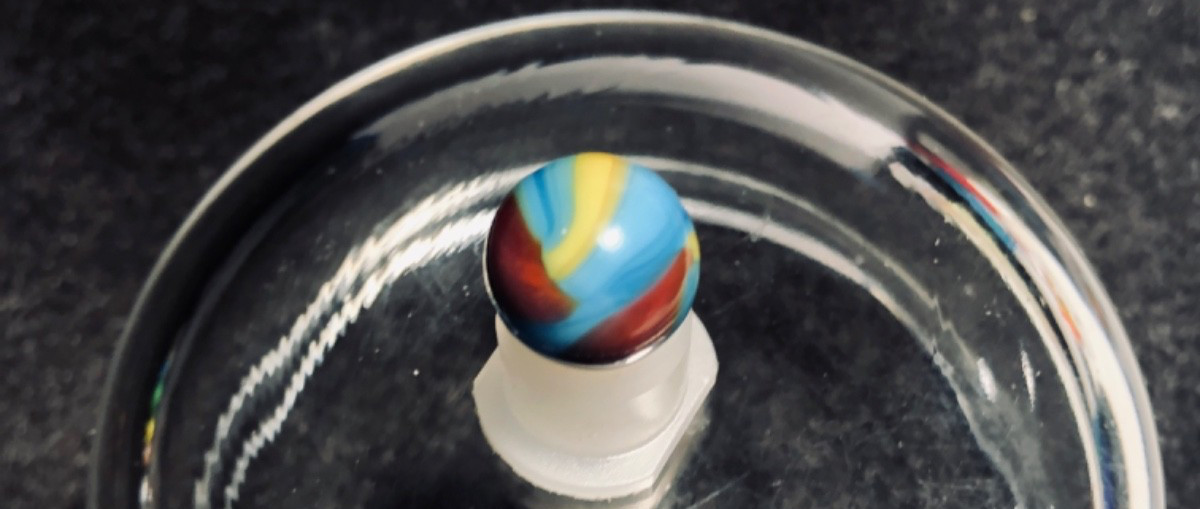 Vintage Peltier Glass Superman Marble .54 in Mint