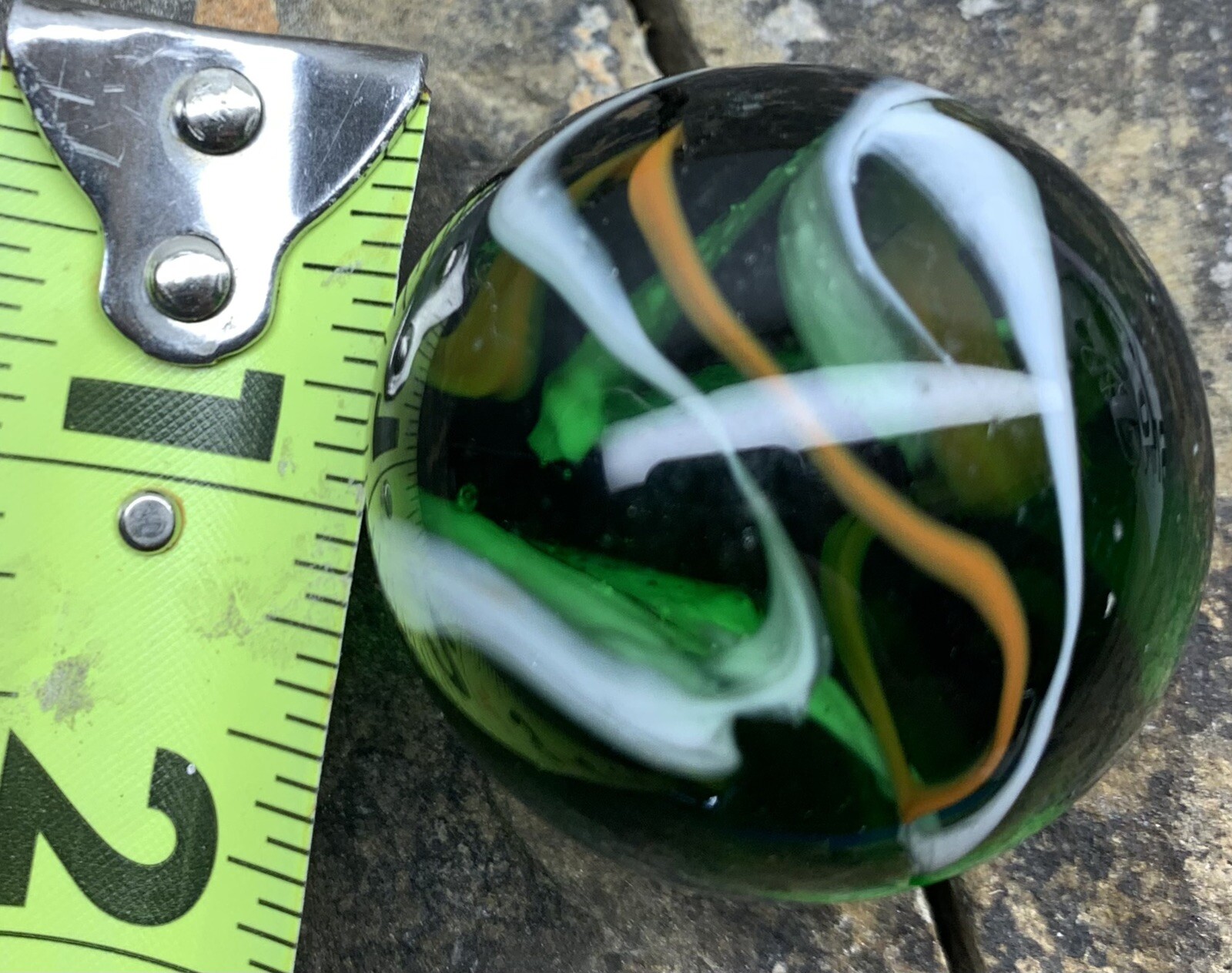 Glass Marble 1.5” In Diameter. Used. Green With Swirls