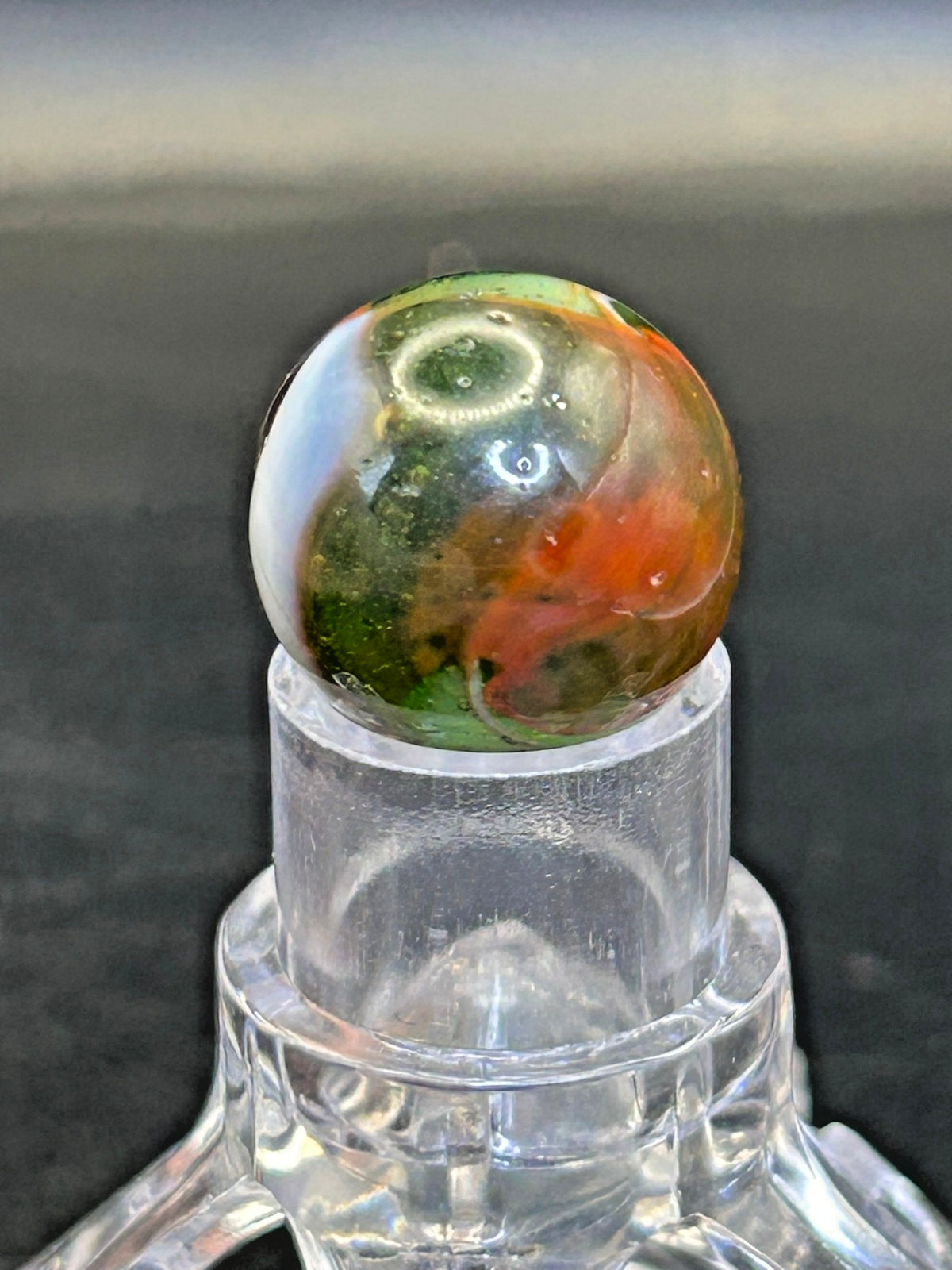 Peltier NLR Tri-Lite Marble, Green Base/Orange-Red Ribbon, UV Reactive, .63″ P28