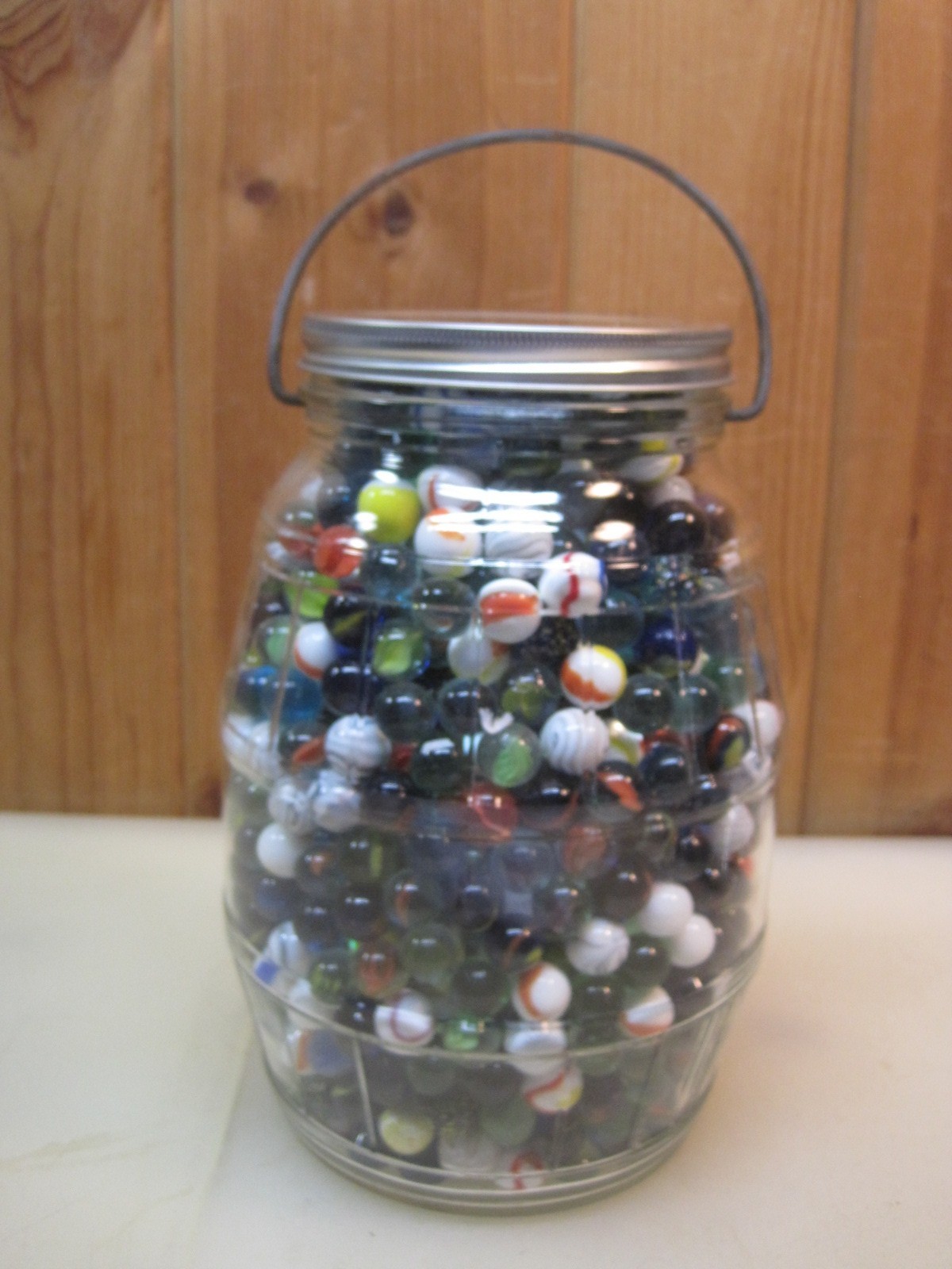 One Gallon Barrel Style Glass Jar Full of 5/8″ & 1″ Glass Marbles B8665