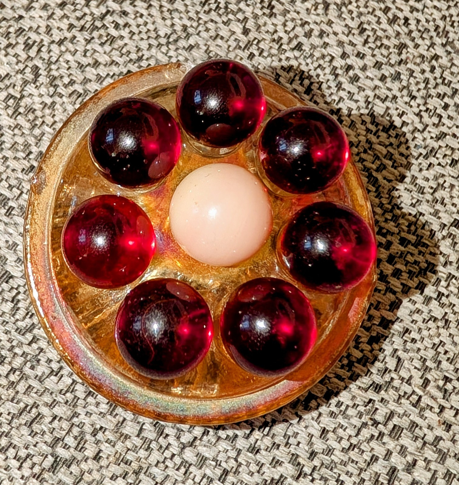 7 Red Cadmium Marbles W/ 1 Burmese Marble On VTG Flower Frog. (Included)