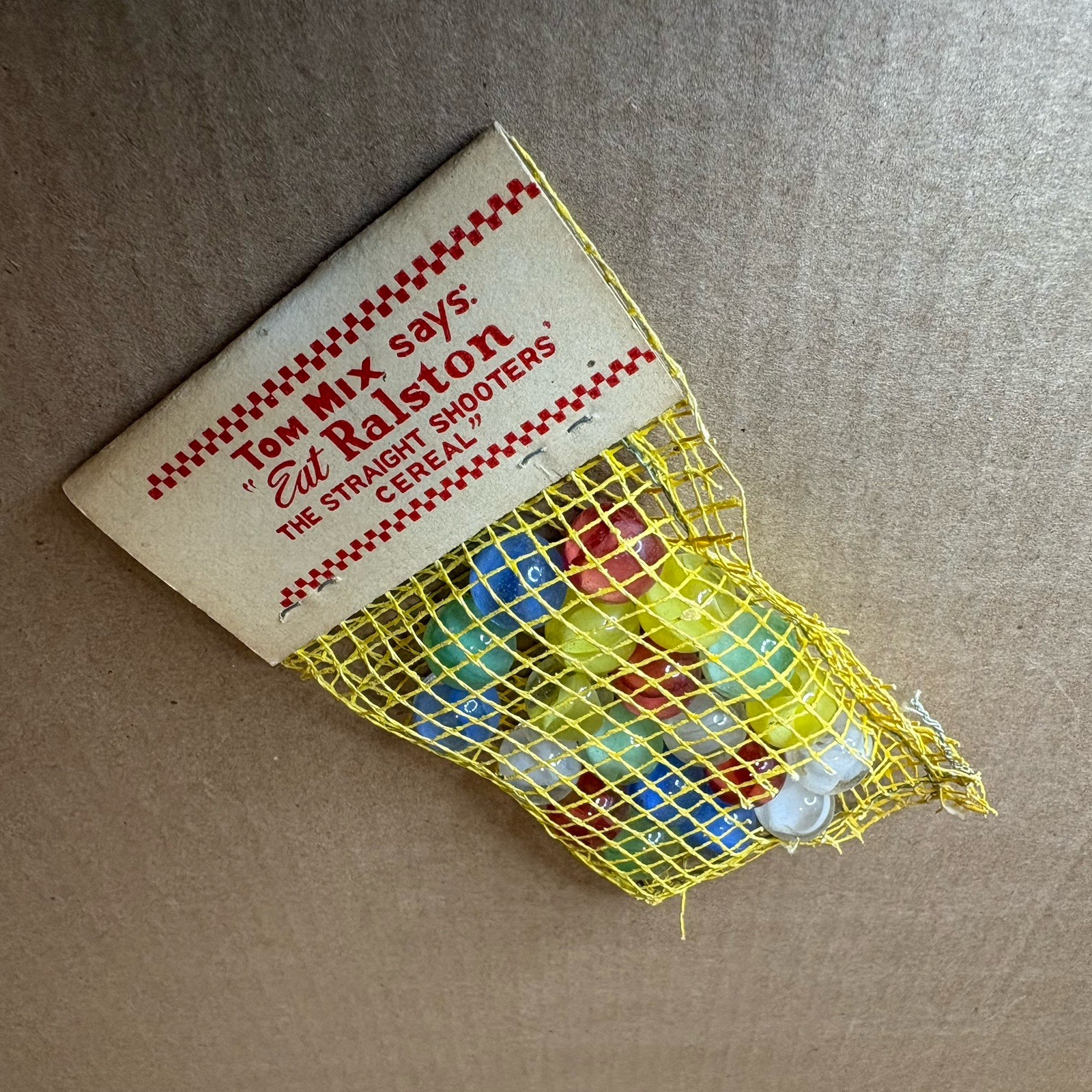Tom Mix Straight Shooter Marbles 1940’s Damage to Bag Complete with Tag Vintage