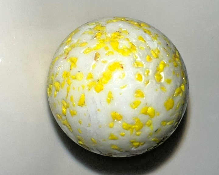 9 classic handmade glass marbles, featuring colorful swirls and unique patterns.