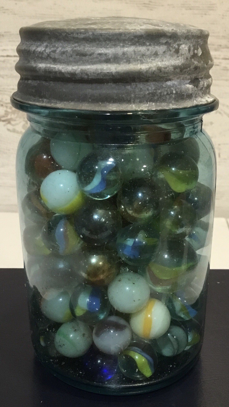 Antique Ball Perfect Mason jar, zinc lid, filled with assorted vintage marbles.