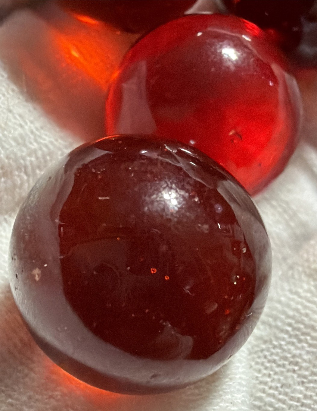 Vintage Lot of 4 Clear Ruby Red Cadmium Slag Glass Marbles UV Reactive As Is