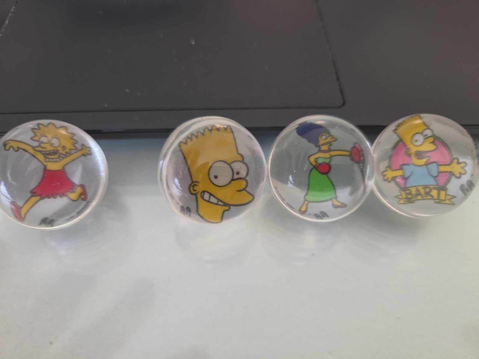 Lot of Four 1990 Spectra Star THE SIMPSONS Rad Rollors Marbles 2 Bart MARGE LISA