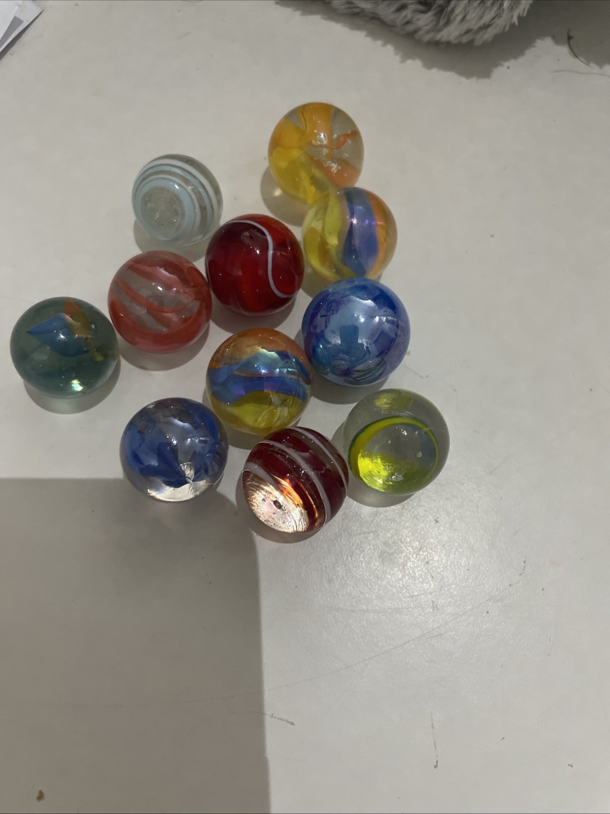 5 Tiny Marbles And 11 Small Marbles