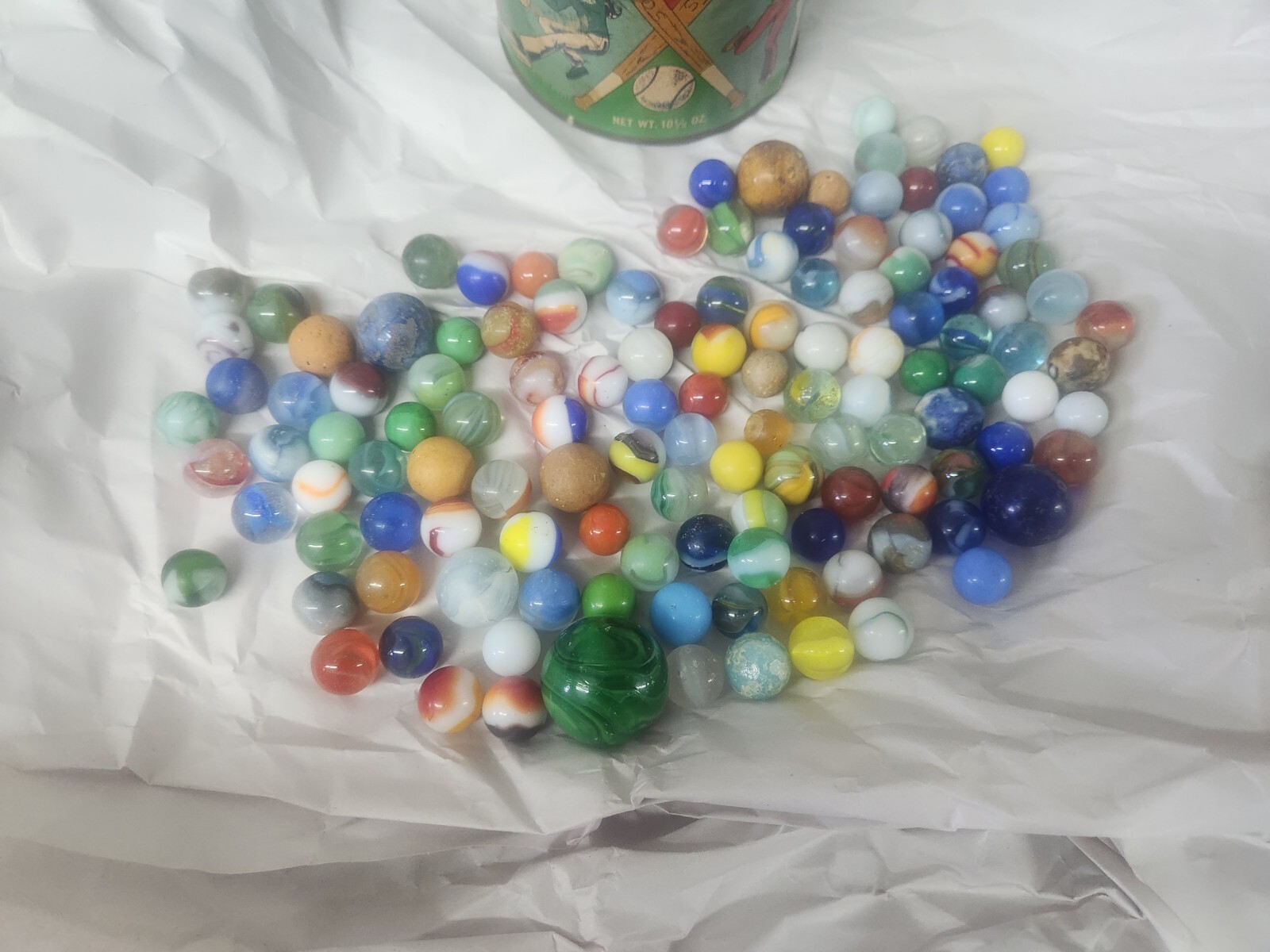 Lot of 130 vintage marbles in vintage Cherrydale Farms peanut Crunch 1950s Can.