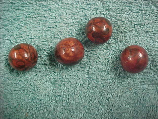 set of 4 hand painted clay marbles glazed.Beautiful.Hard to find