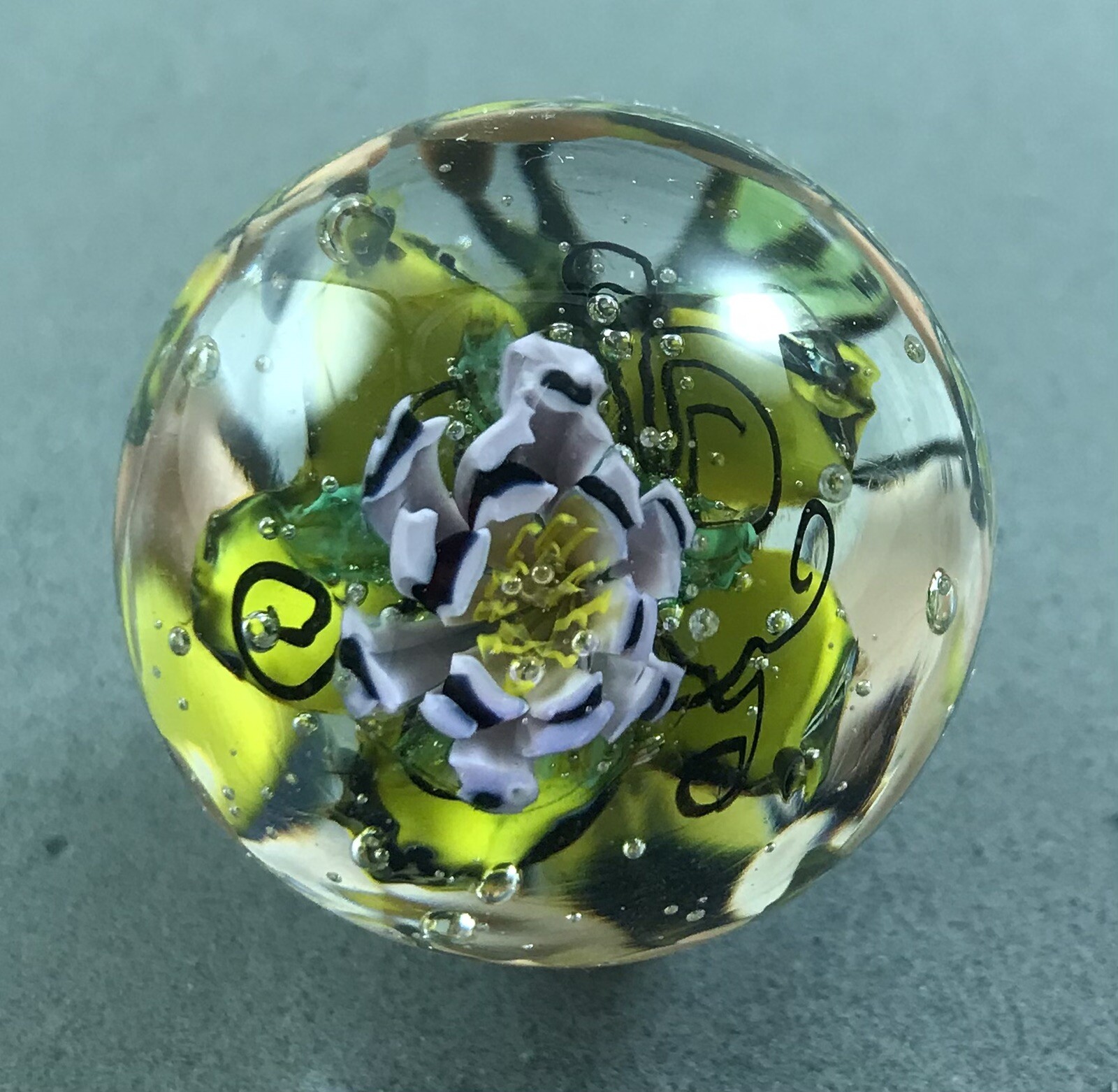 handmade 1 3/4” Purple Murrini Floral glass marble W/ Hand Painted Bug