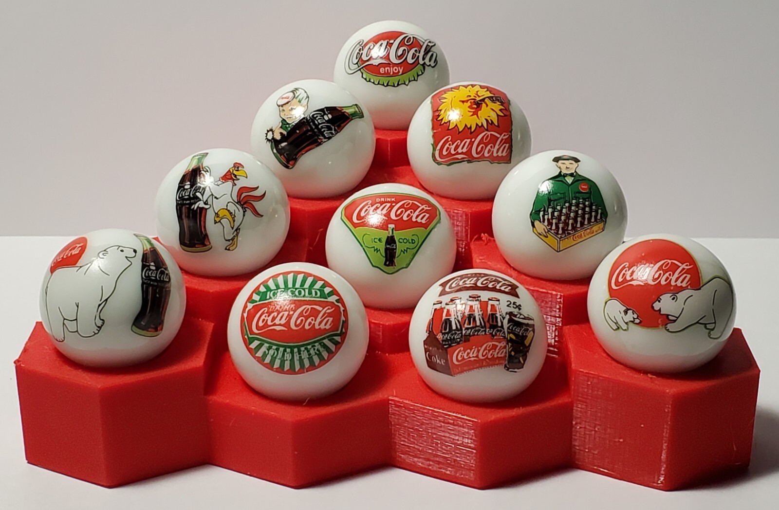 Set of 10 Coke 1″ Glass Logo Marbles w/ Stand