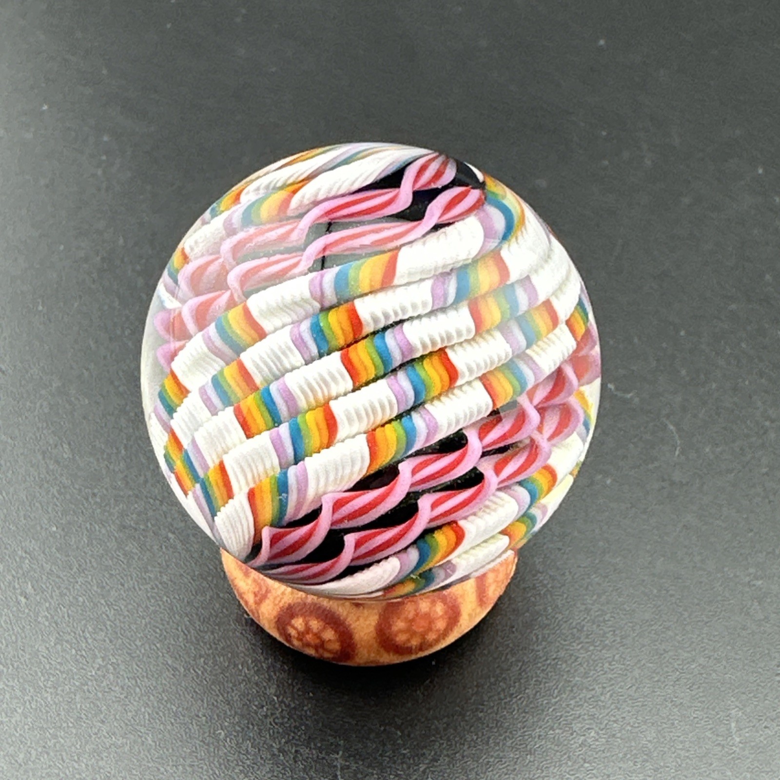 Contemporary Handmade Art Glass Marble 1.34″ Rainbow White Pink Cane, Black Core