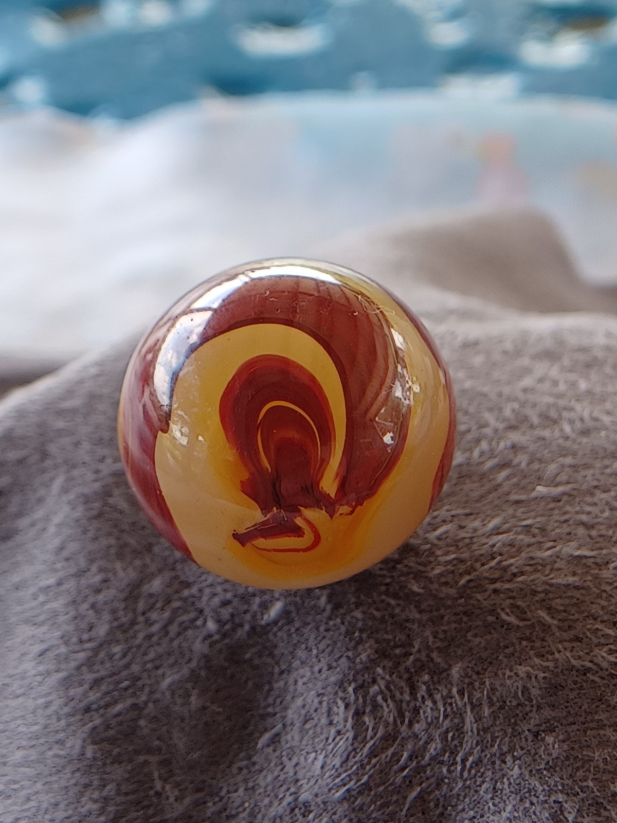 “Golden Onyx Oxblood” .70 Shiney wet dead mint. Very old and rare marble. 1920s