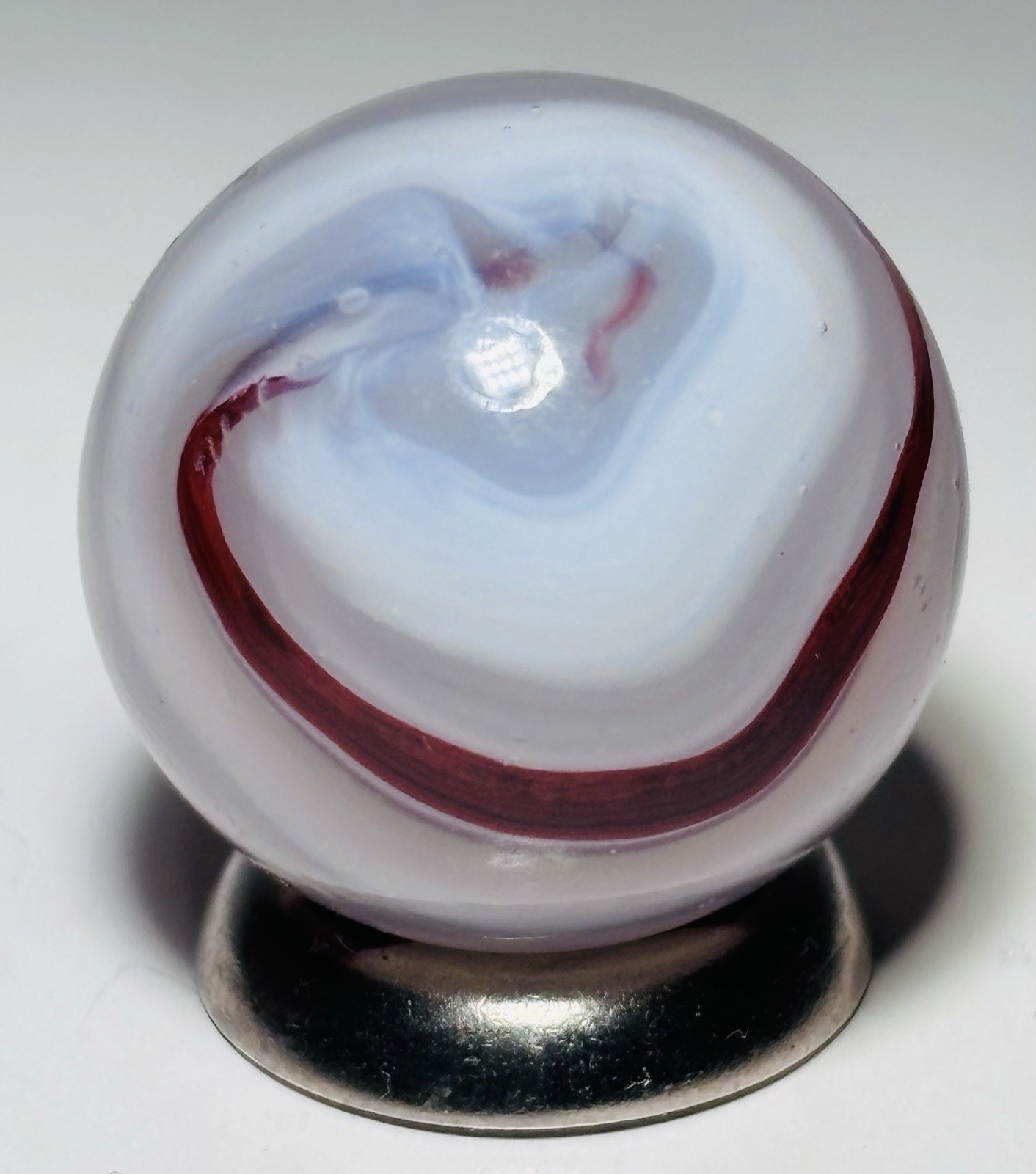 Vintage Akro Agate Silver OXblood Corkscrew Marble.72” In Mint Condition