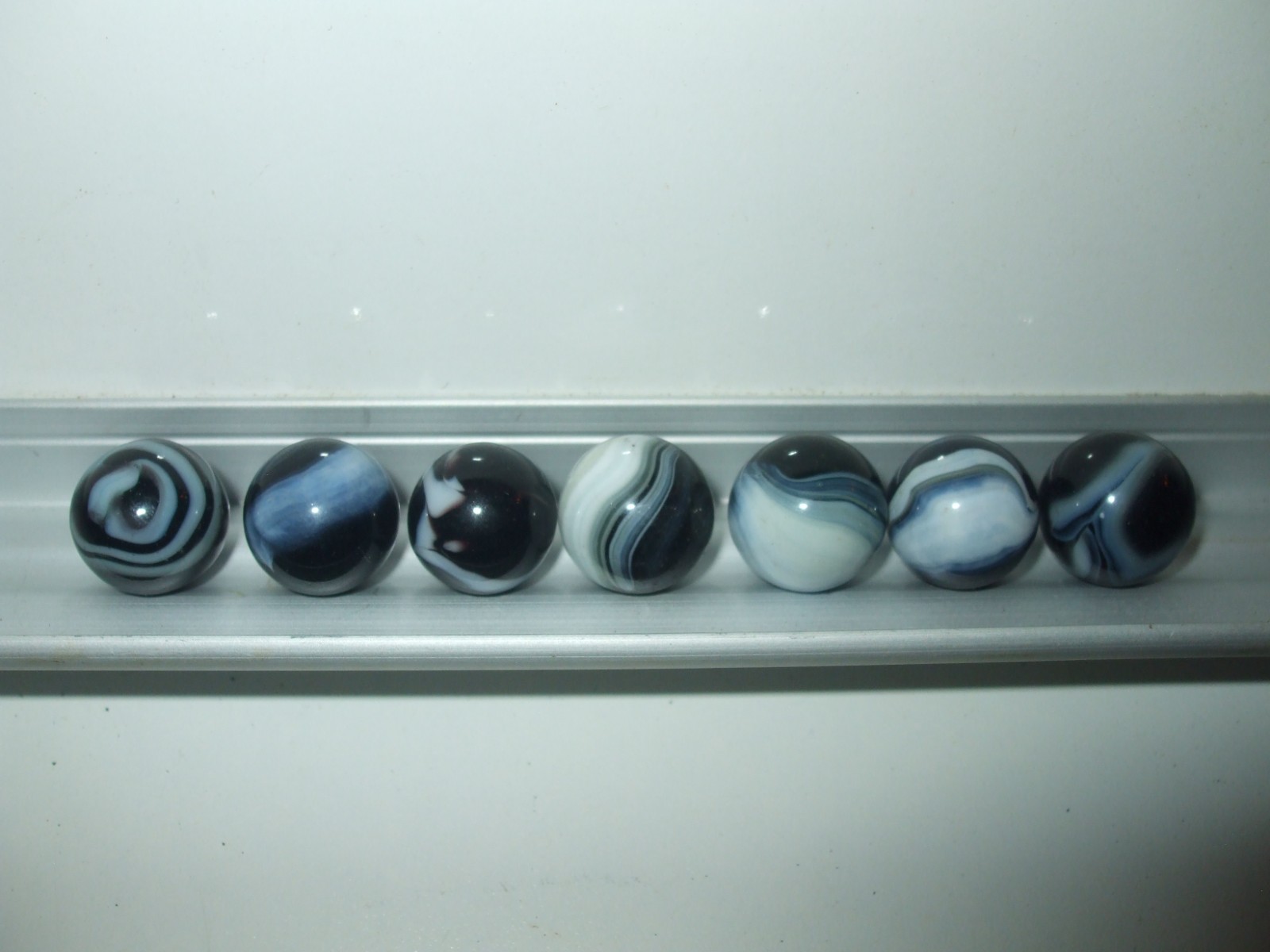 7 Vintage Glass Black and White Swirl Marbles