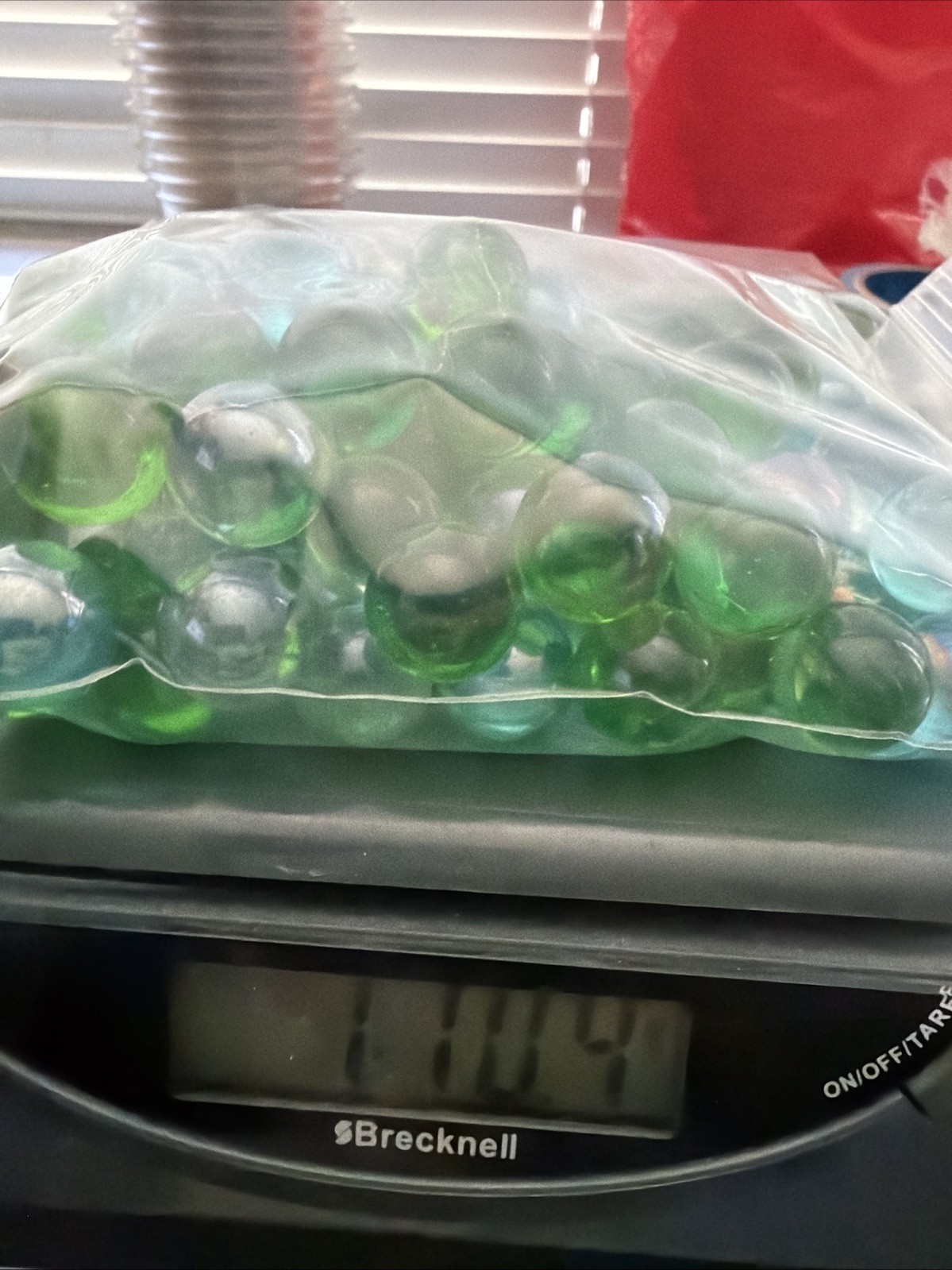 Lot of Assorted Marbles 1 pound 14 ounces, clear and green And Blue