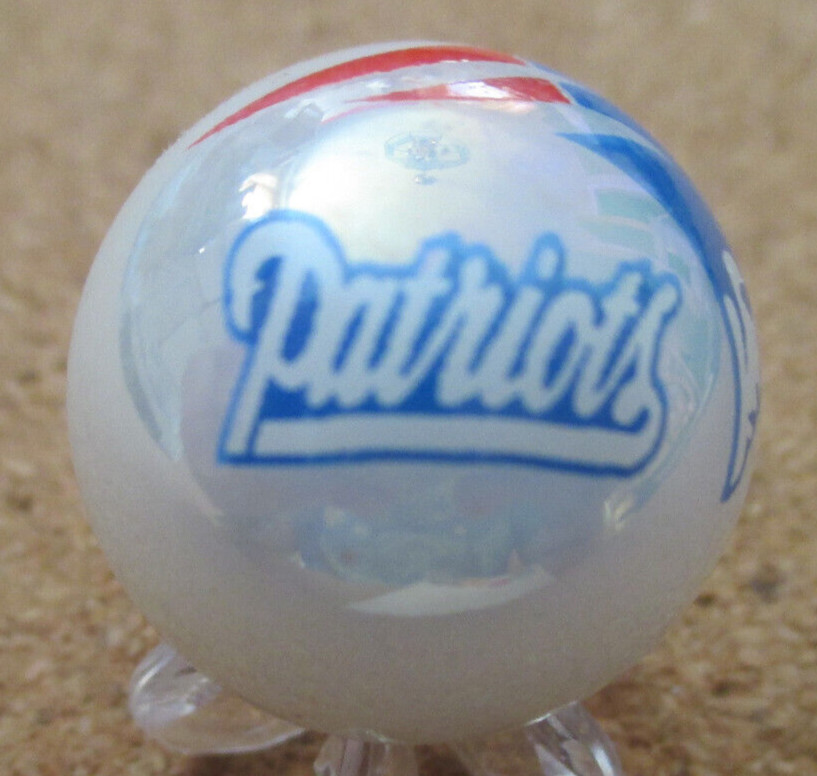 NFL: New England Patriots Logo on a Pearl Jabo Marble #111 .987″ = 25.06mm