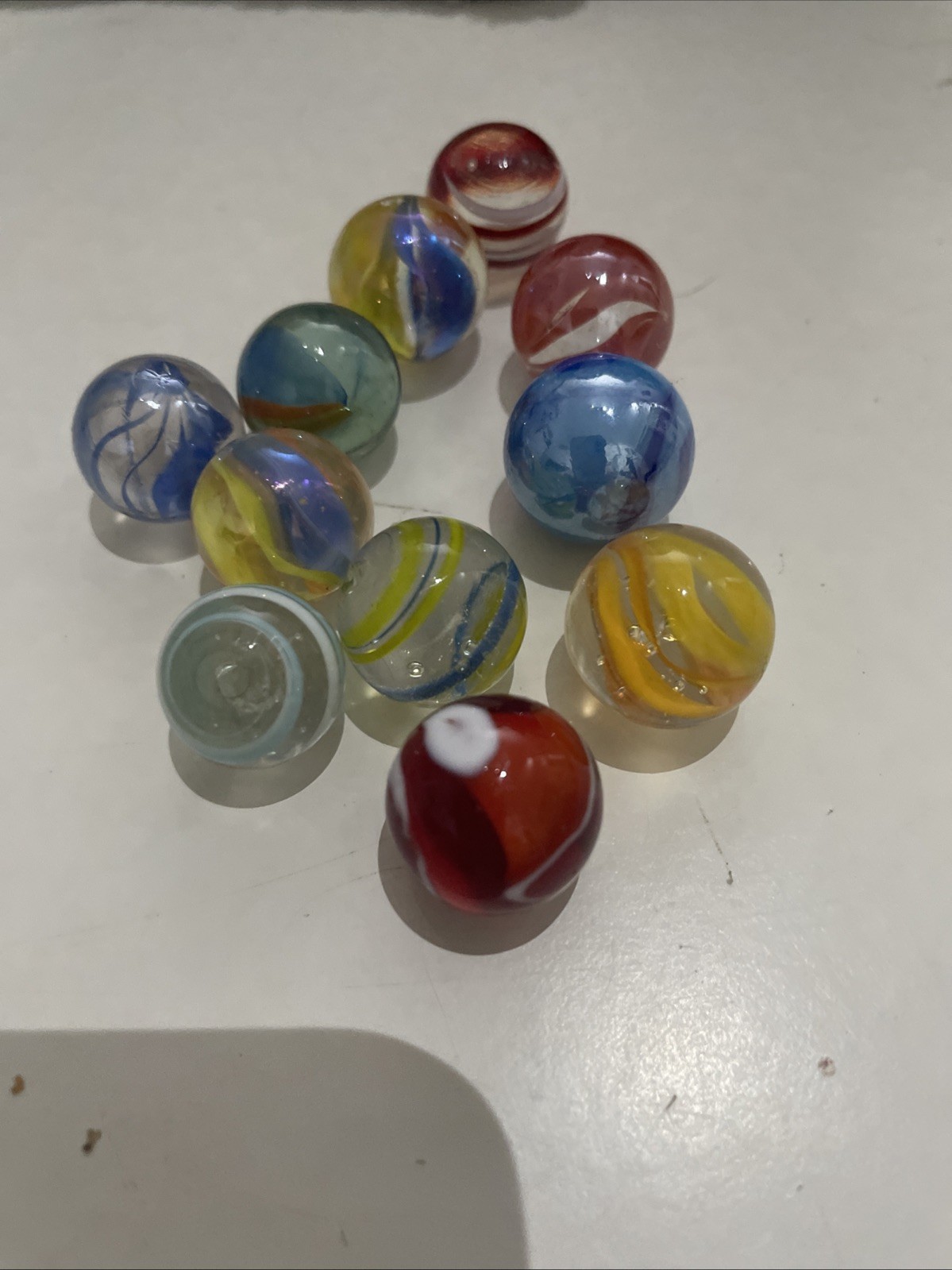 5 Tiny Marbles And 11 Small Marbles