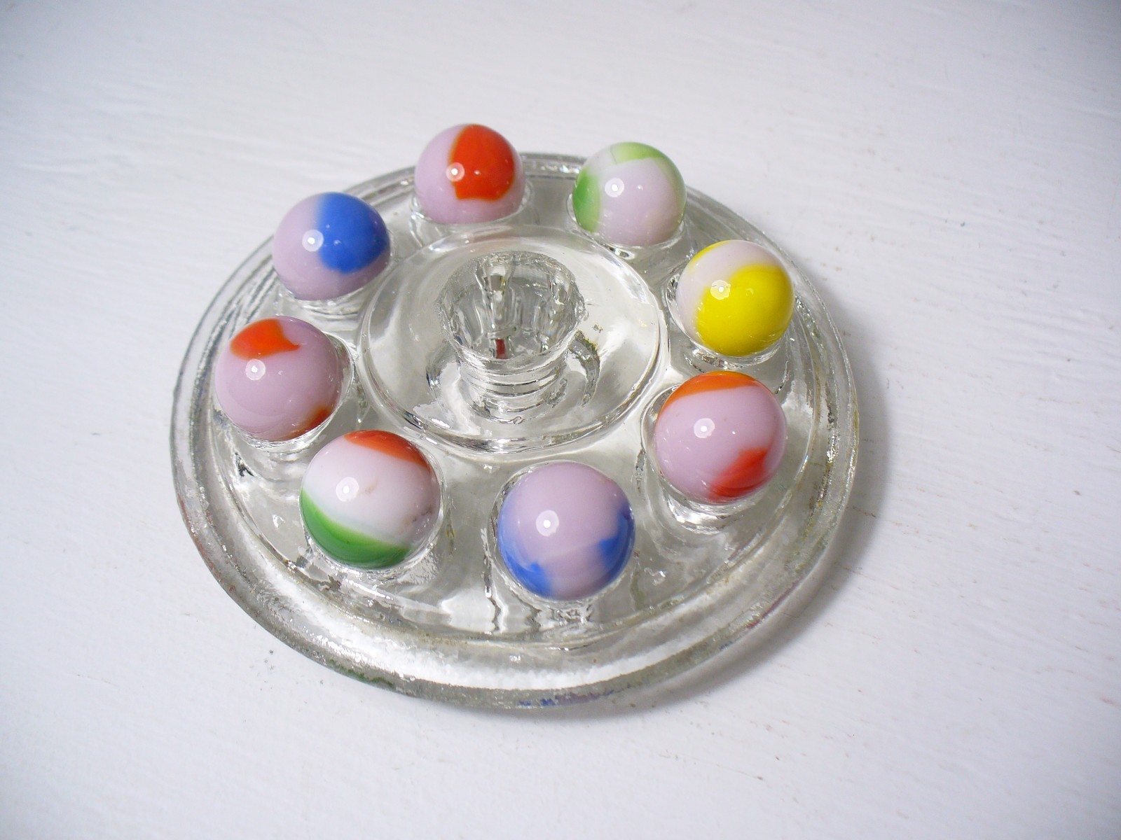 #914 Vintage Marble King Rainbows 8 Pieces all are on a Pink base