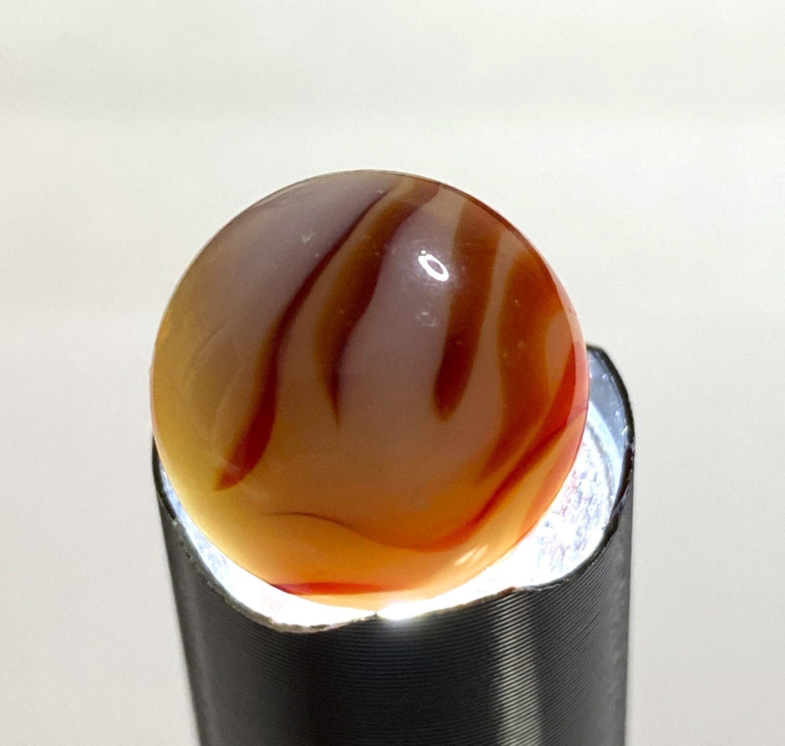 ALLEY AGATE CO. TRANSPARENT LIGHT BROWN FLAME SWIRL .63″ NM – MAA149