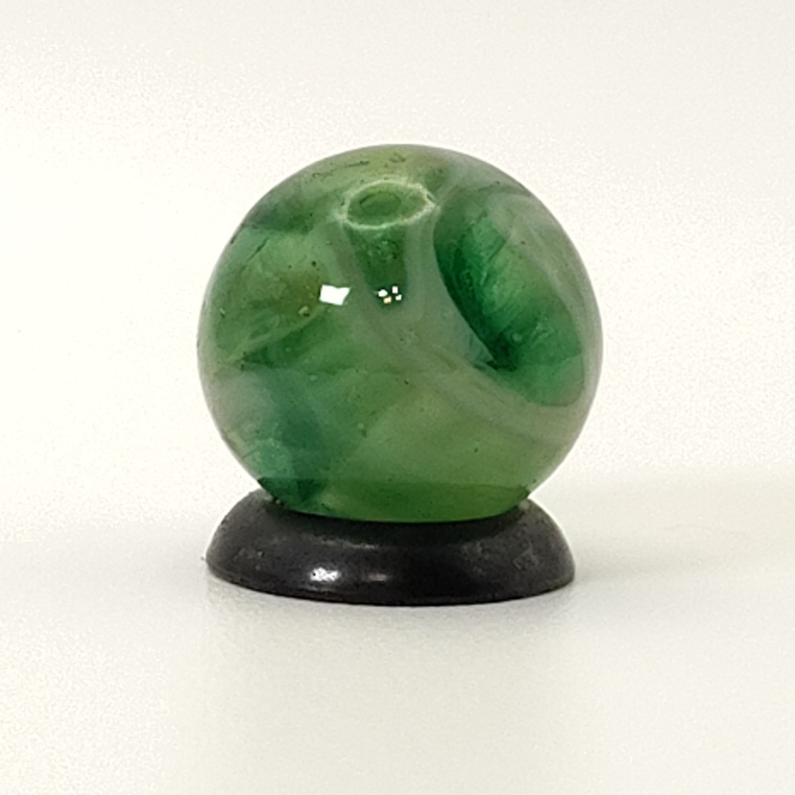 9/16″ Swirl Marble green transparent base w/white & tan ribbons great backlit NM