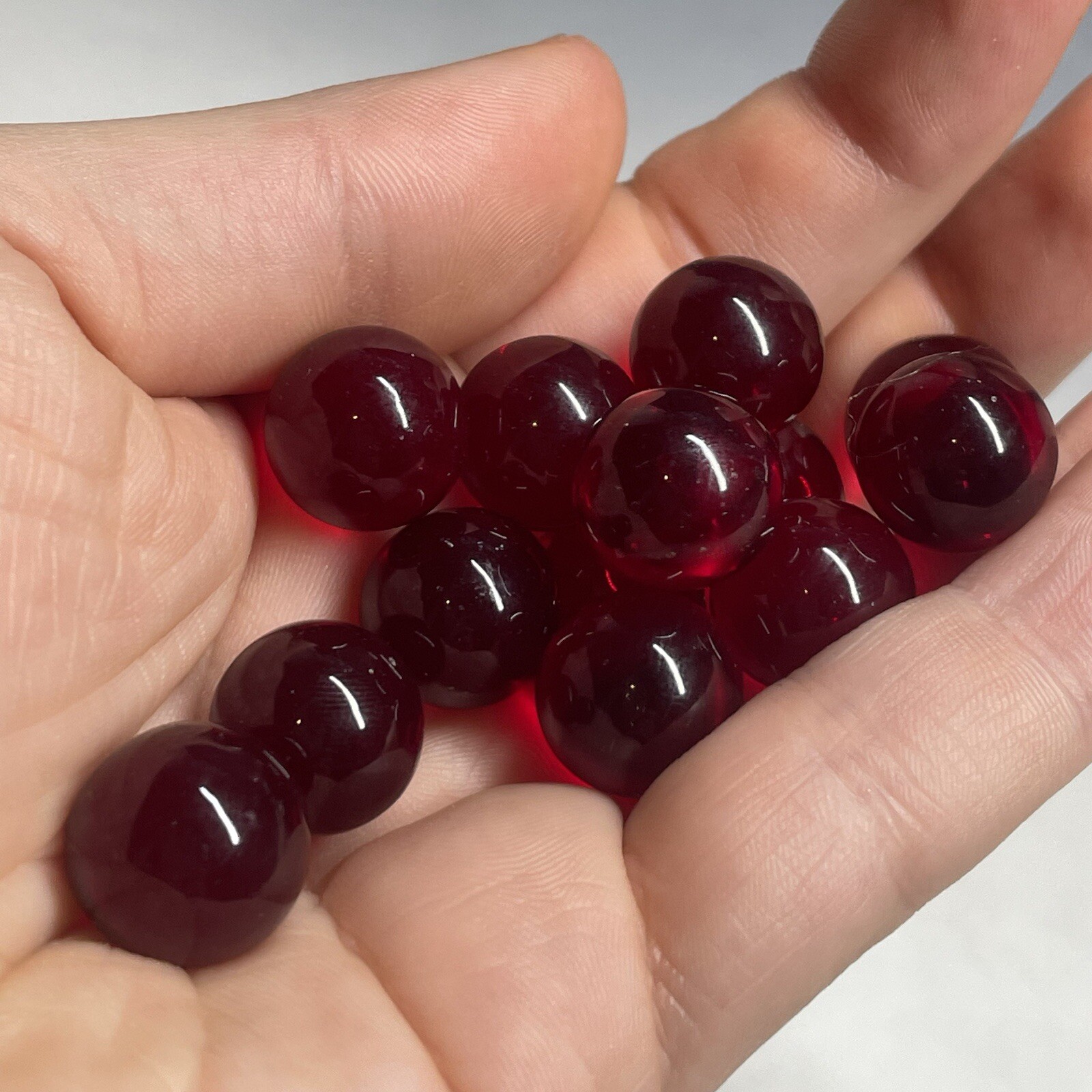 Lot of (13) Vintage Red UV Cadmium Orange Swirl Clear Glass Marbles