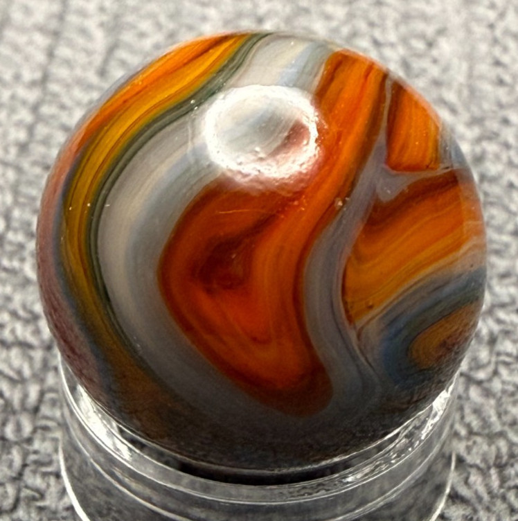 JABO / DAS .63″ Mint UV Glows Oxblood Orange Blue Yellow Swirl Marble (274)