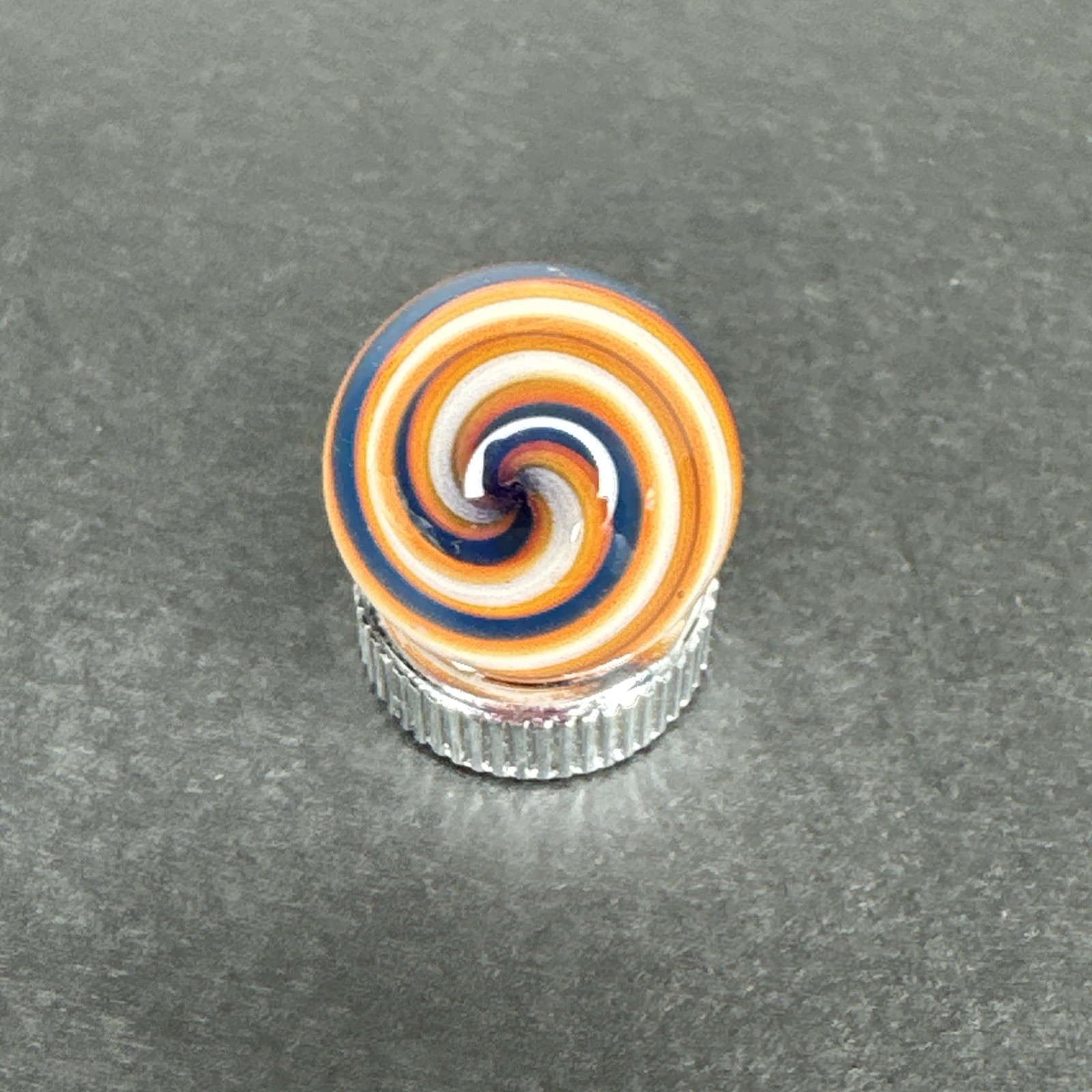Contemporary Handmade Art Glass Marble .66″ Navy Blue White Orange UV Glow Swirl