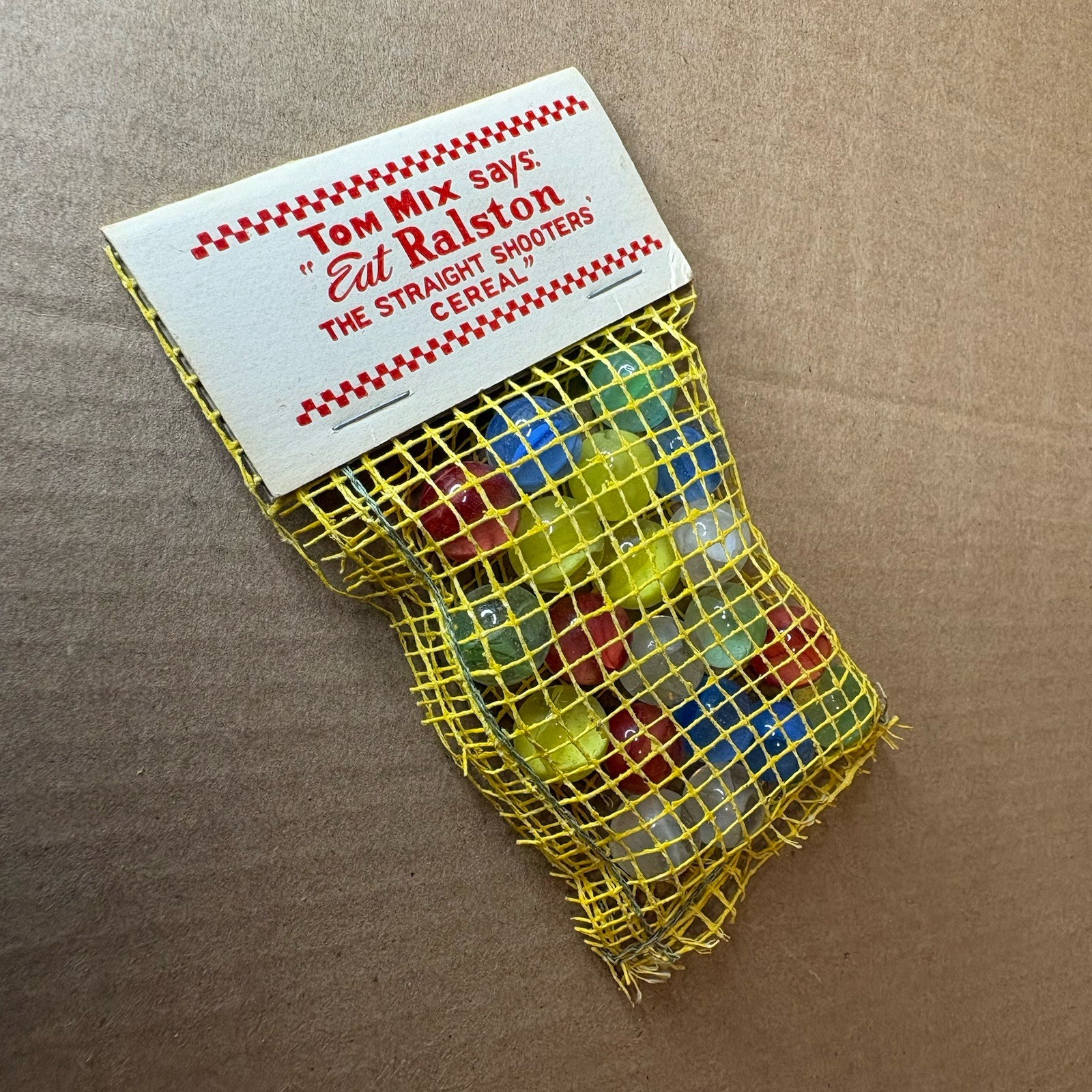 Tom Mix Straight Shooter Marbles 1940’s Damage to Bag Complete with Tag Vintage