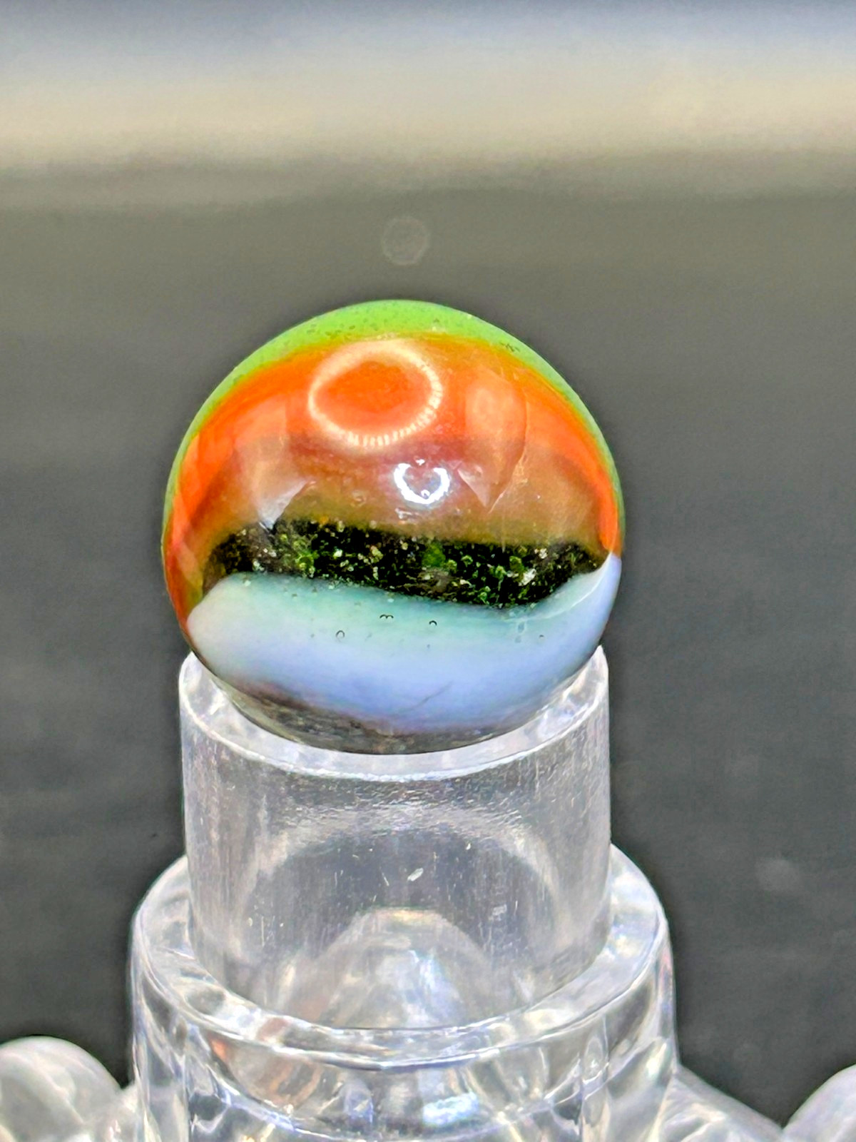 Peltier NLR Tri-Lite Marble, Green Base/Orange-Red Ribbon, UV Reactive, .63″ P28
