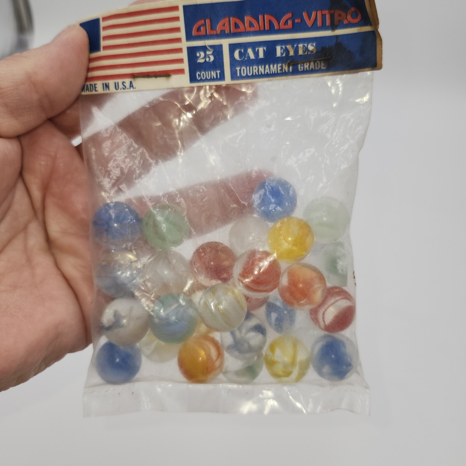 2 VINTAGE GLADDING VITRO AGATE 25 COUNT BAG OF CAGED FINGERED CAT EYES MARBLES