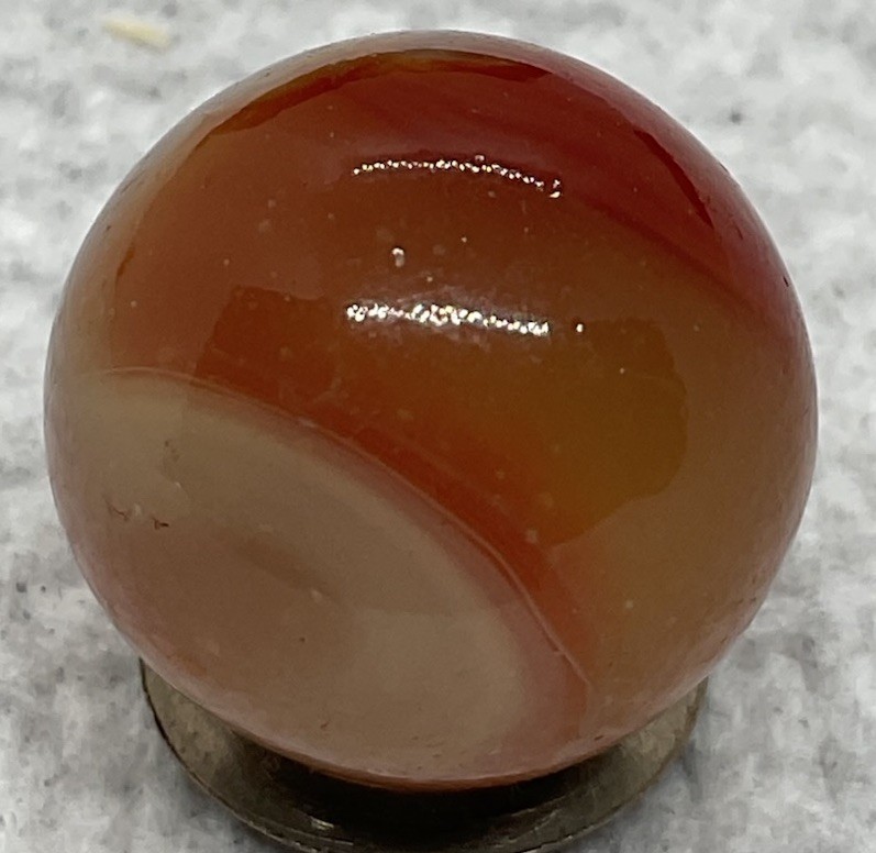 A Vintage Akro Agate Carnelian UV Marble. It Measures .70”, Near Mint Condition