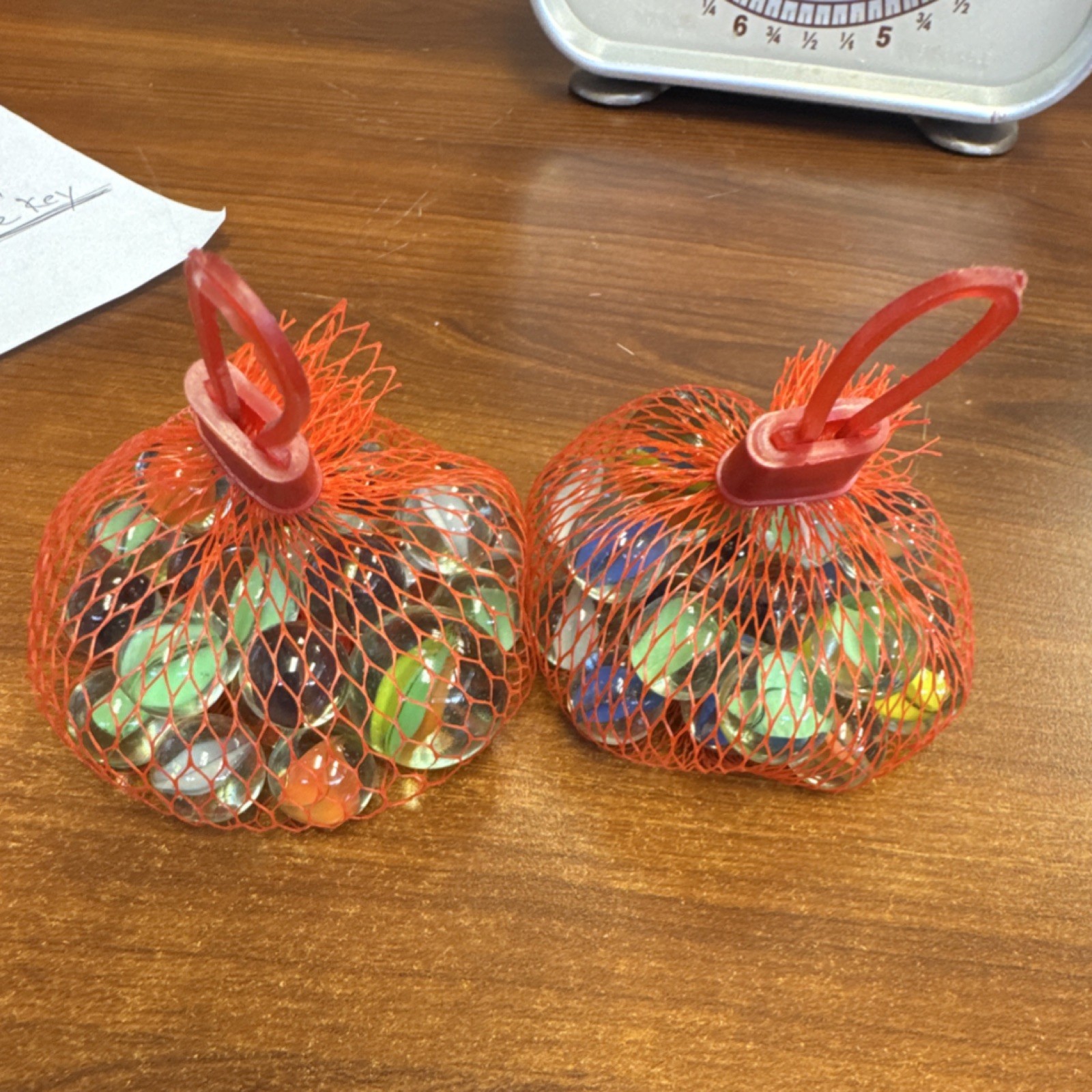 2 bags of Marbles in Red Mesh Bags roughly 3/4 pounds
