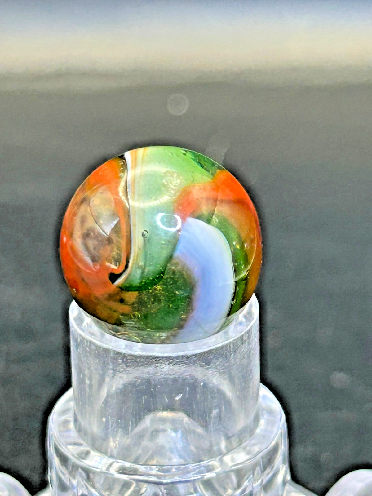 Peltier NLR Tri-Lite Marble, Green Base/Orange-Red Ribbon, UV Reactive, .63″ P28
