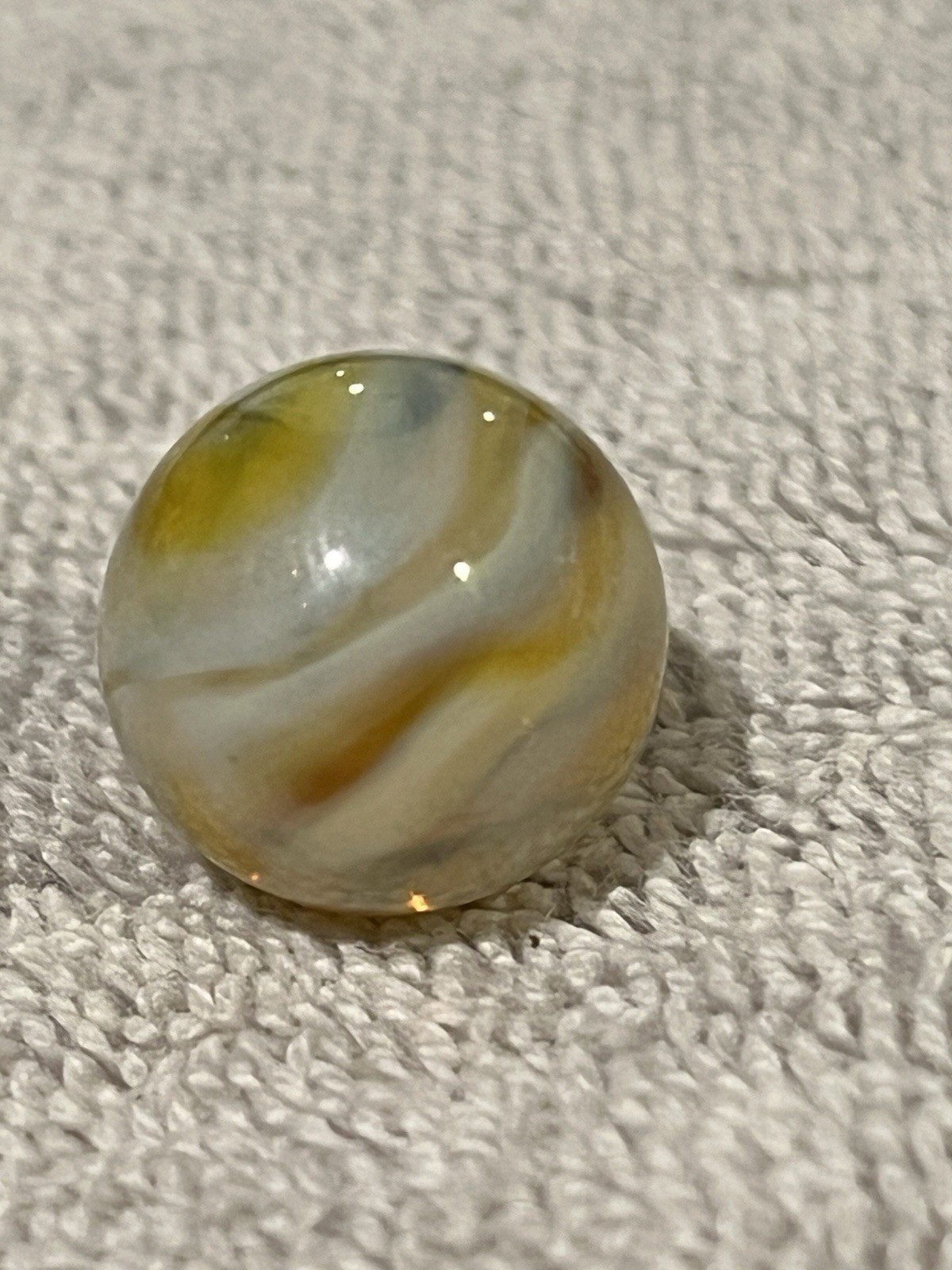 Alley or Champion Yellow Gold Translucent Furnace Swirl .63 Wet Mint