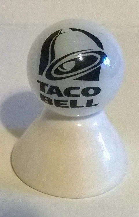 T-A-C-O B-E-L-L LOGO ON WHITE PEARL MARBLE