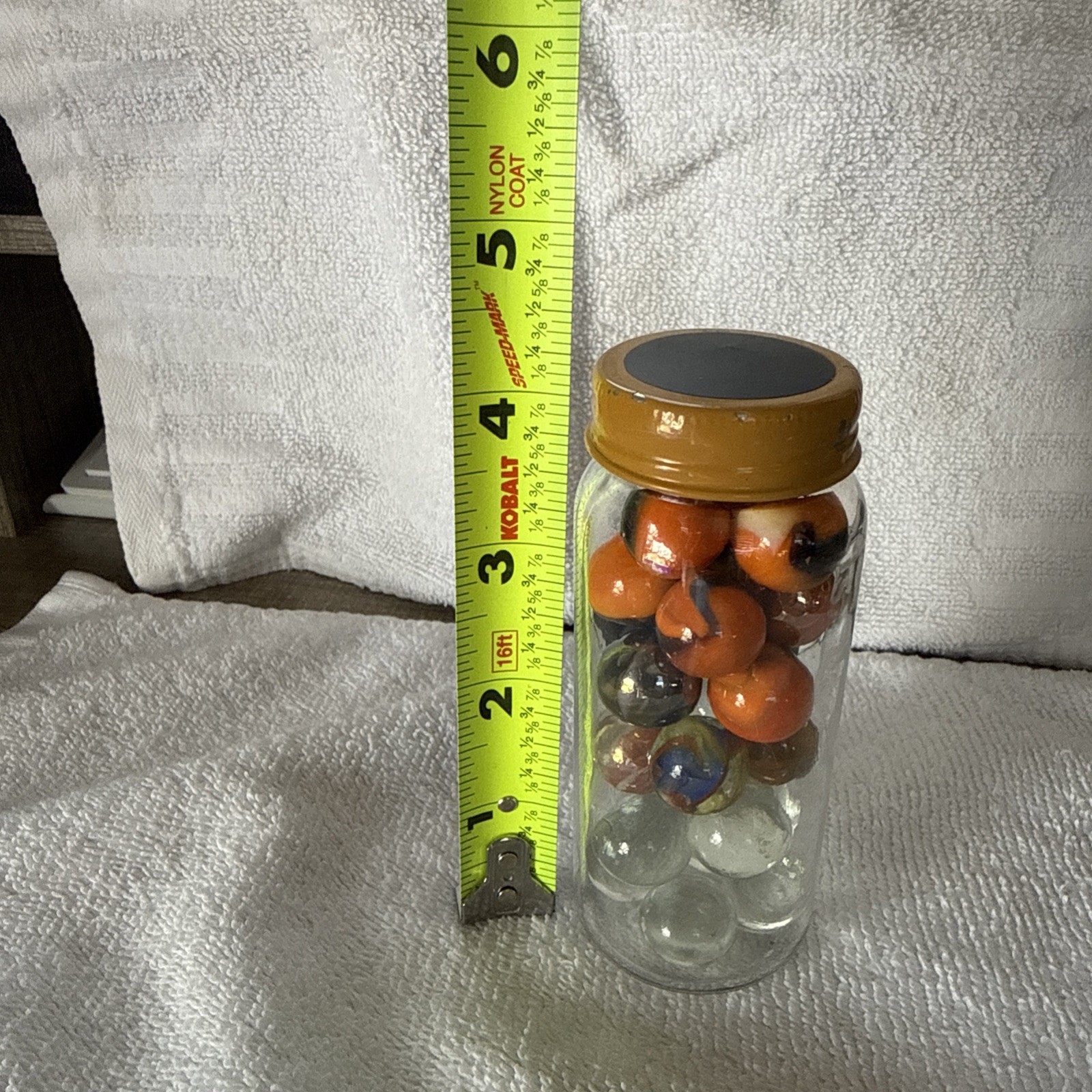A Jar Of 24 Marbles Including The Jar, Which Is Kind Of Cool Looking!
