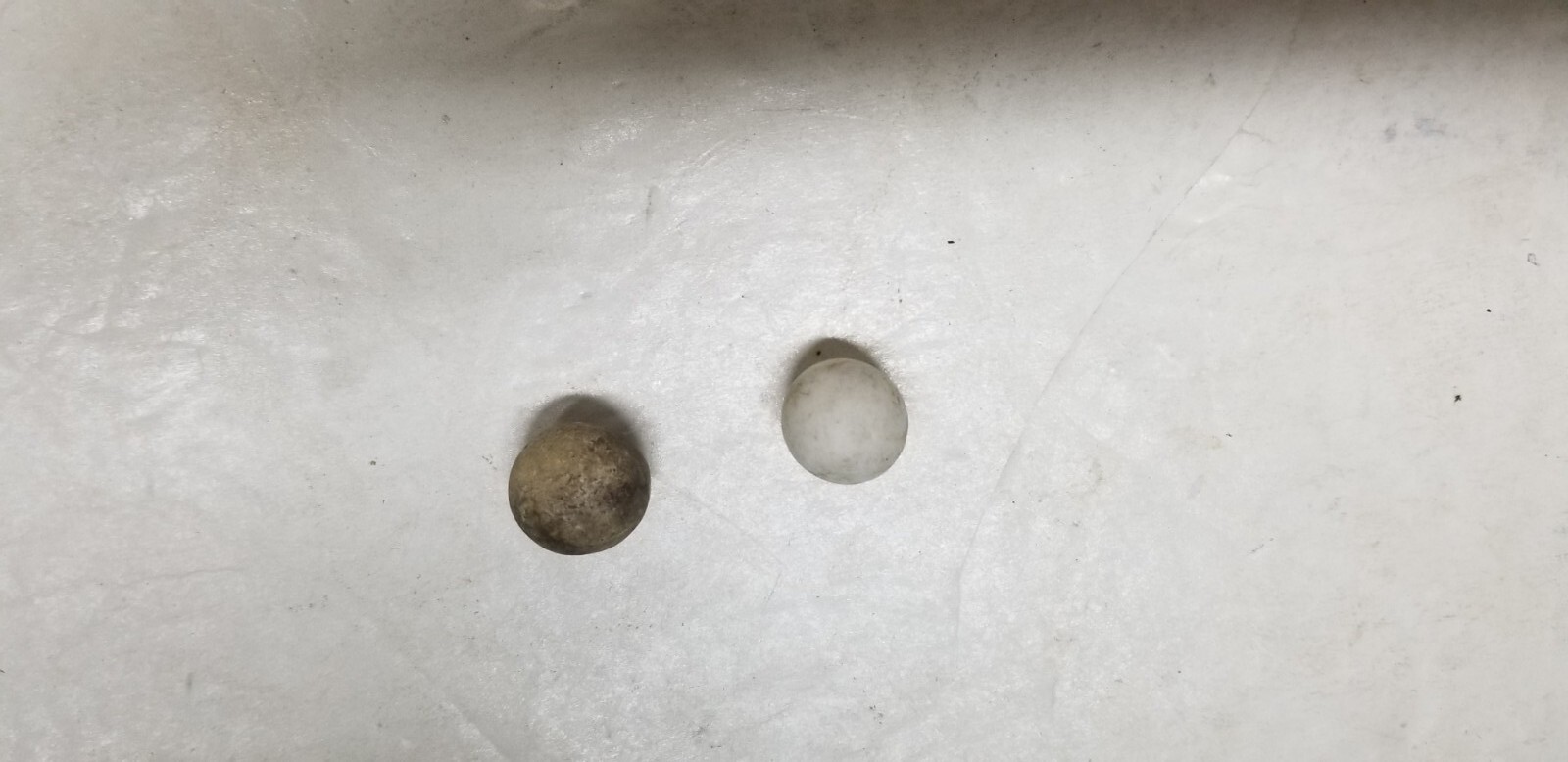 2 ANTIQUE STONEWARE MARBLES