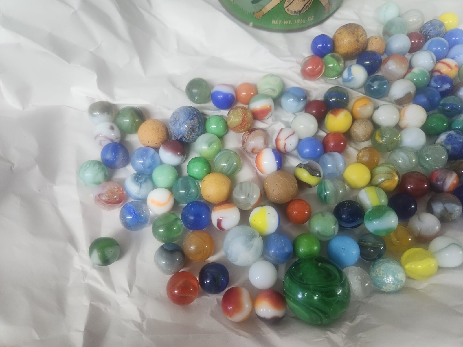 Lot of 130 vintage marbles in vintage Cherrydale Farms peanut Crunch 1950s Can.