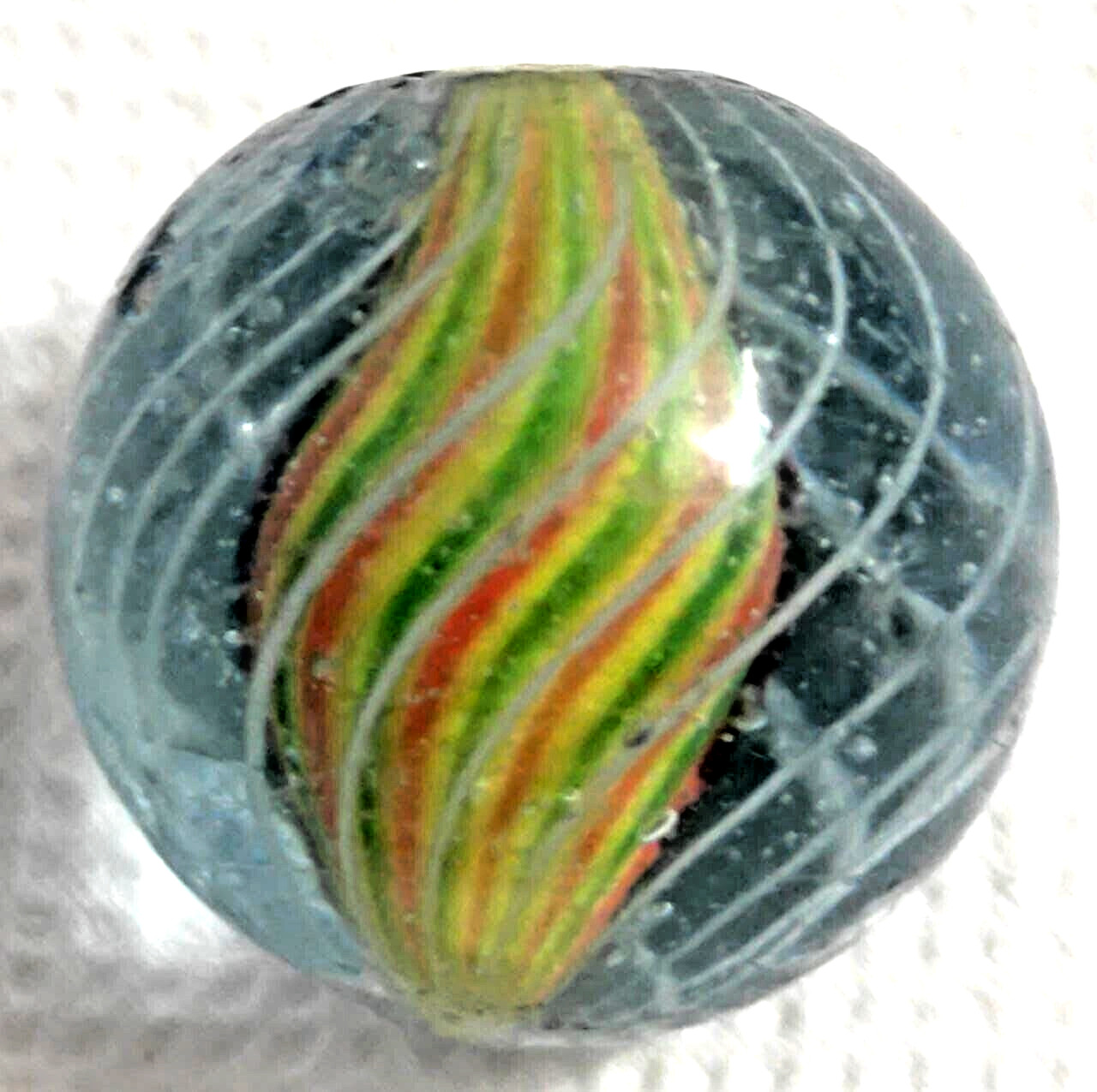 OLD 2 TOY MARBLES multi colored solid core caged 1 tri level ,2 blue base glass